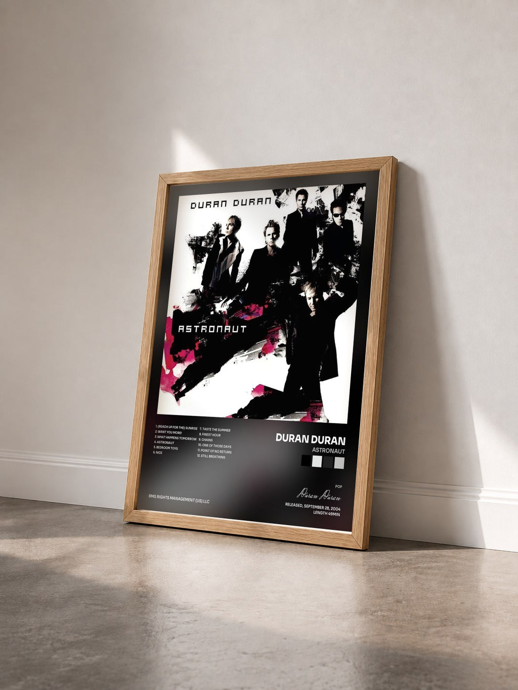 #bois Tableau de l'album Astronaut de Duran Duran vu de trois quarts, cadre en bois brut