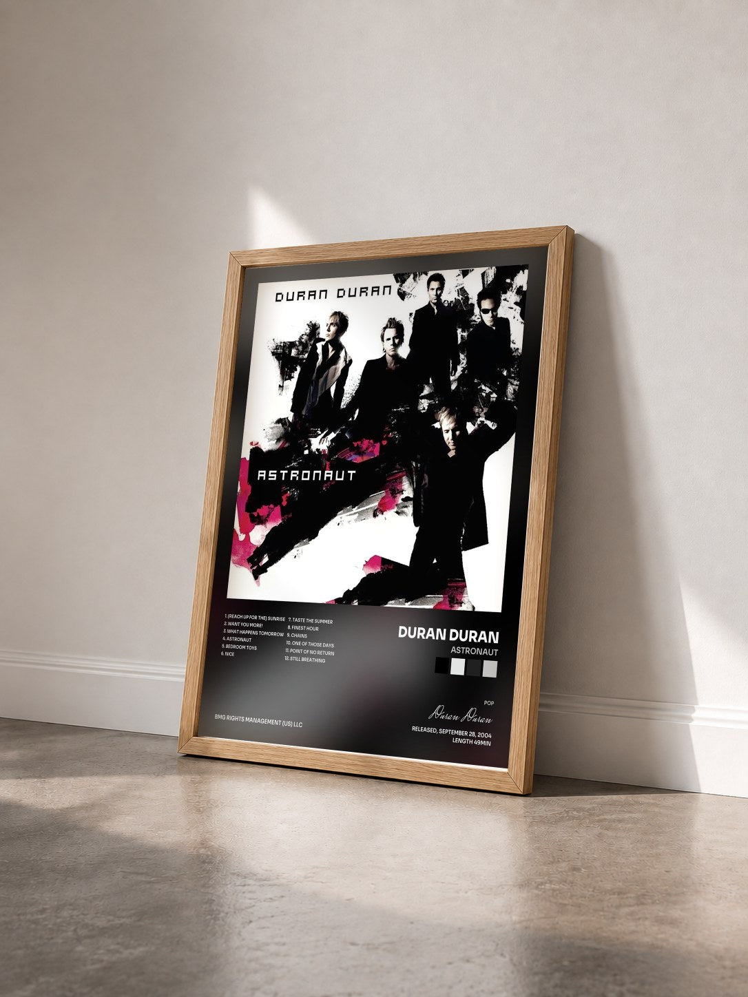 #bois Tableau de l'album Astronaut de Duran Duran vu de trois quarts, cadre en bois brut