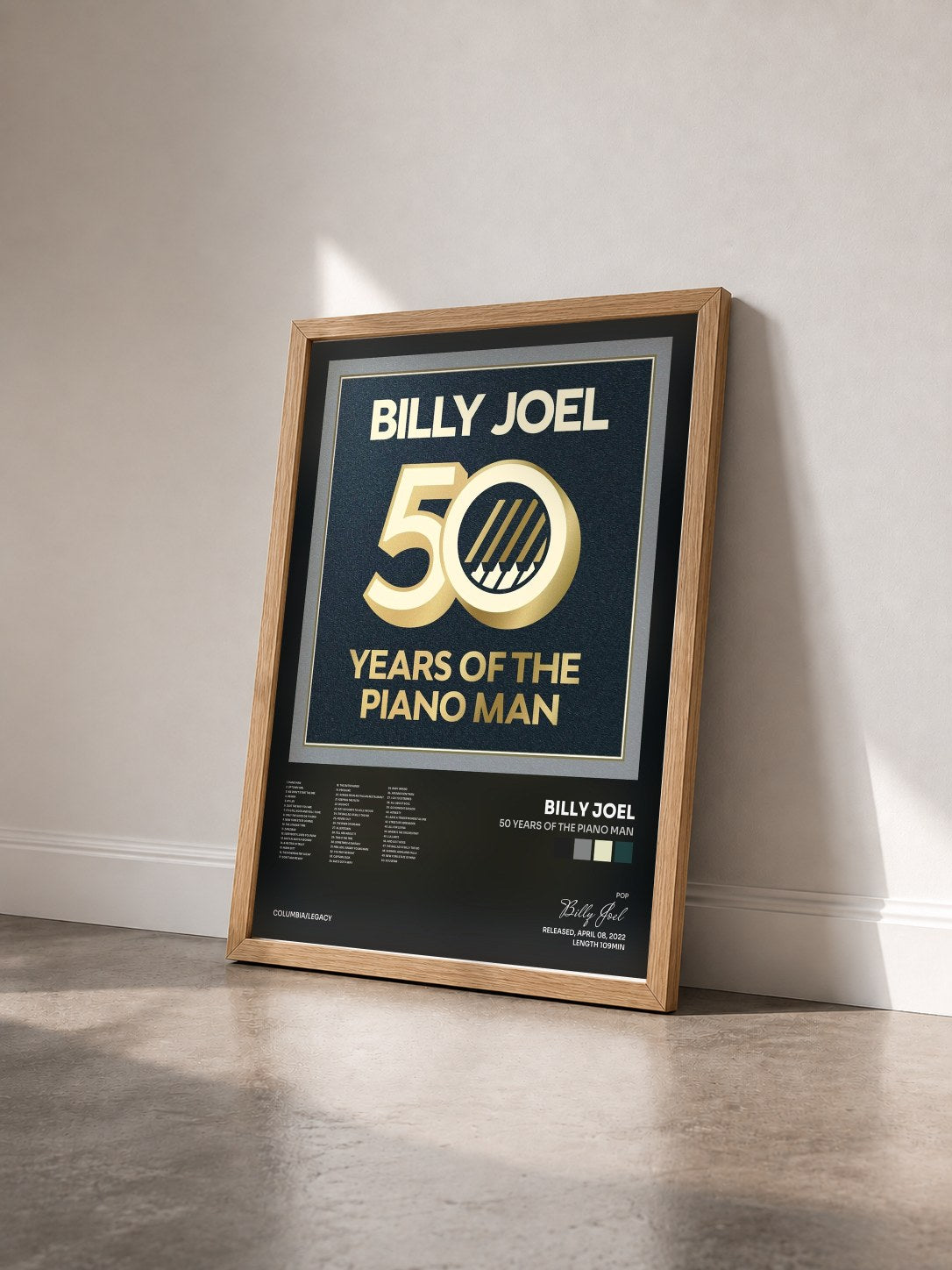 #bois Tableau de l'album 50 Years of the Piano Man de Billy Joel vu de trois quarts, cadre en bois brut
