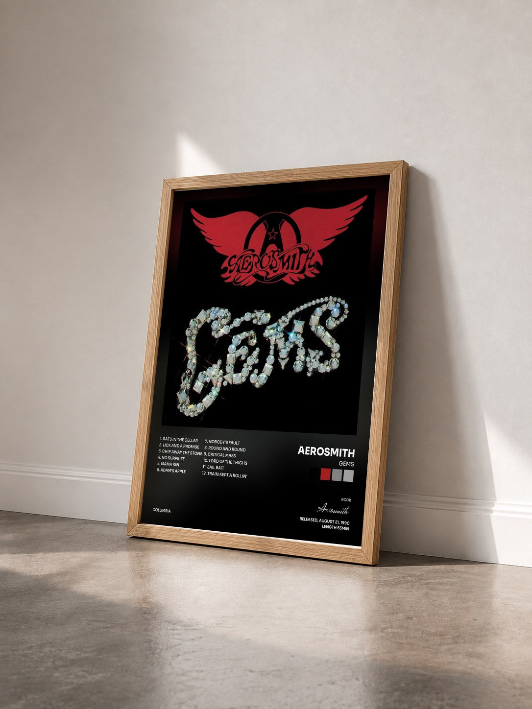 #bois Tableau de l'album Gems de Aerosmith vu de trois quarts, cadre en bois brut