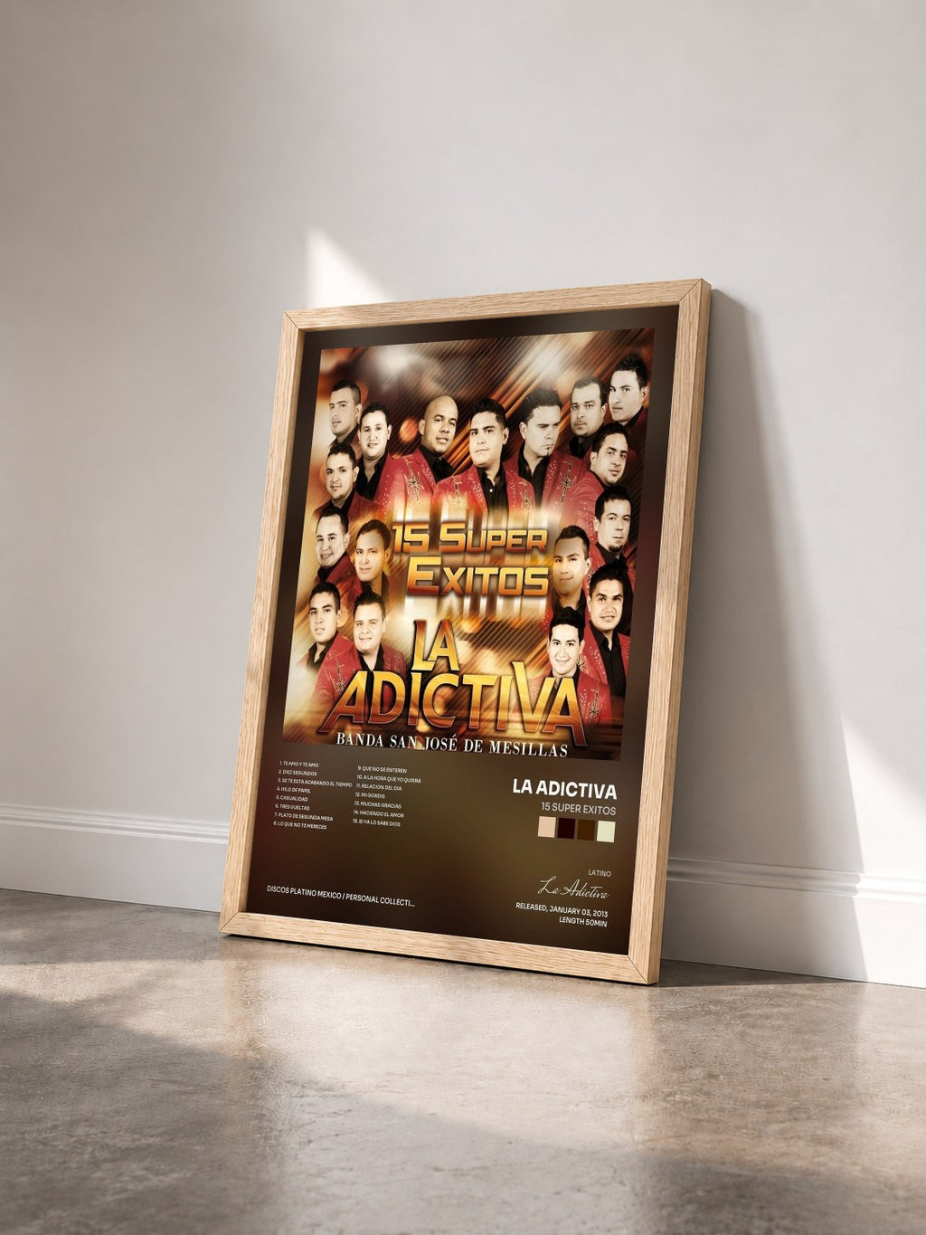 #bois Tableau de l'album 15 Super Exitos de La Adictiva vu de trois quarts, cadre en bois brut