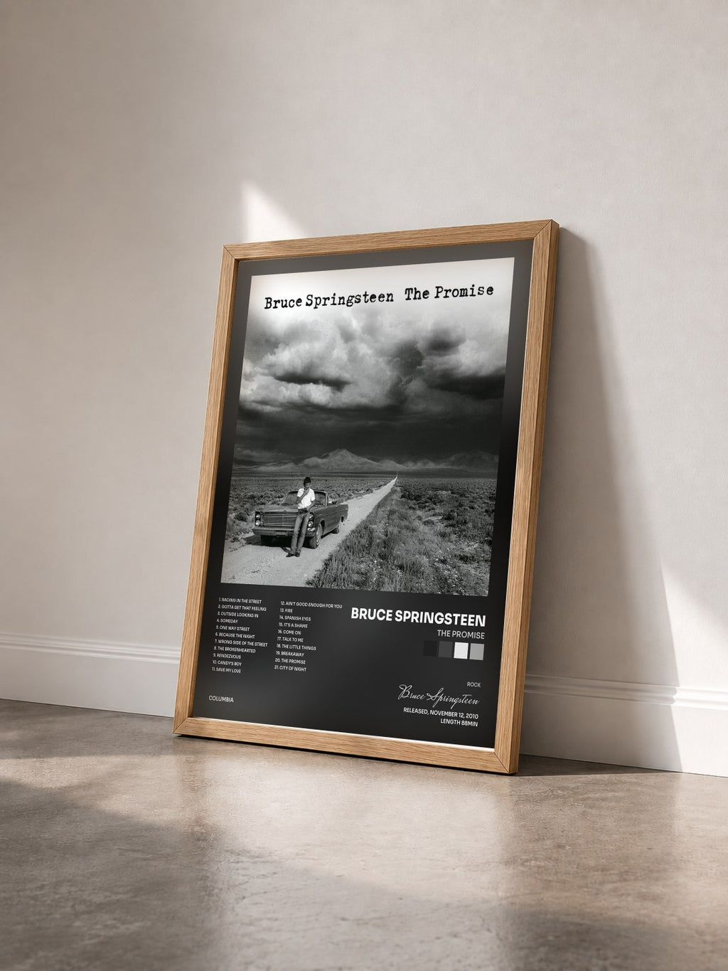 #bois Tableau de l'album The Promise de Bruce Springsteen vu de trois quarts, cadre en bois brut
