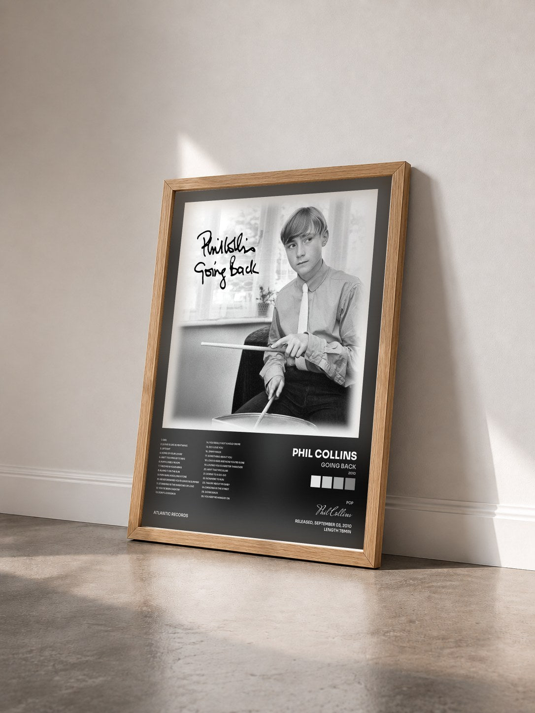 #bois Tableau de l'album Going Back (2010) de Phil Collins vu de trois quarts, cadre en bois brut