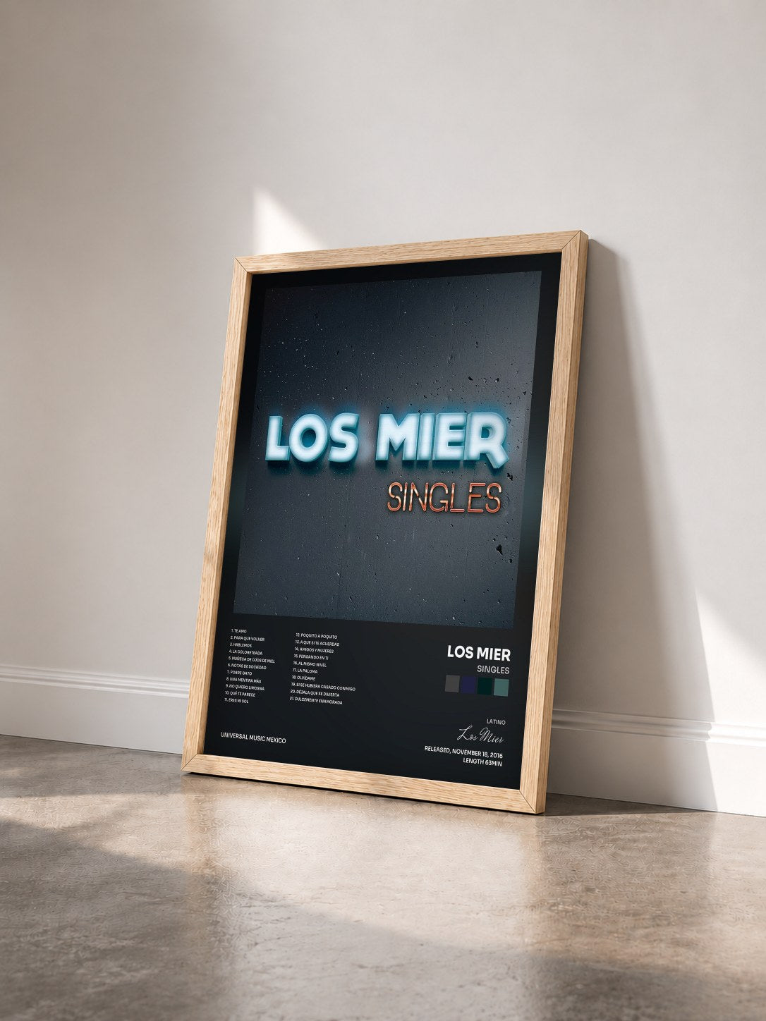 #bois Tableau de l'album Singles de Los Mier vu de trois quarts, cadre en bois brut