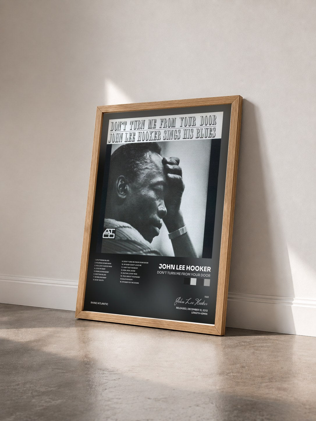 #bois Tableau de l'album Don't Turn Me From Your Door de John Lee Hooker vu de trois quarts, cadre en bois brut