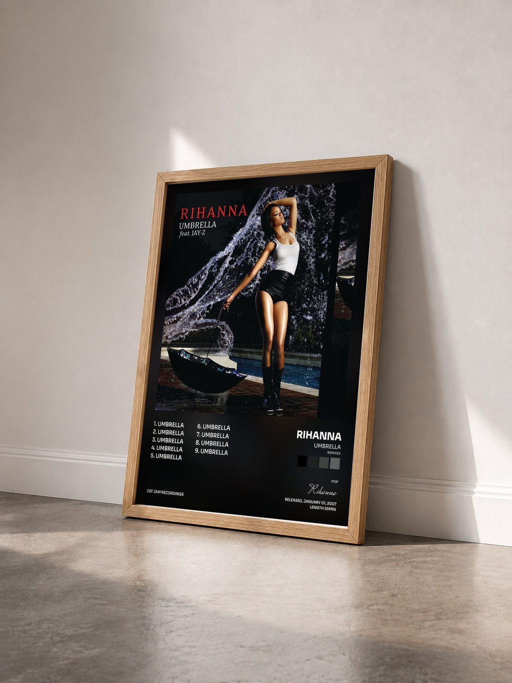 #bois Tableau de l'album Umbrella (Remixes) de Rihanna vu de trois quarts, cadre en bois brut