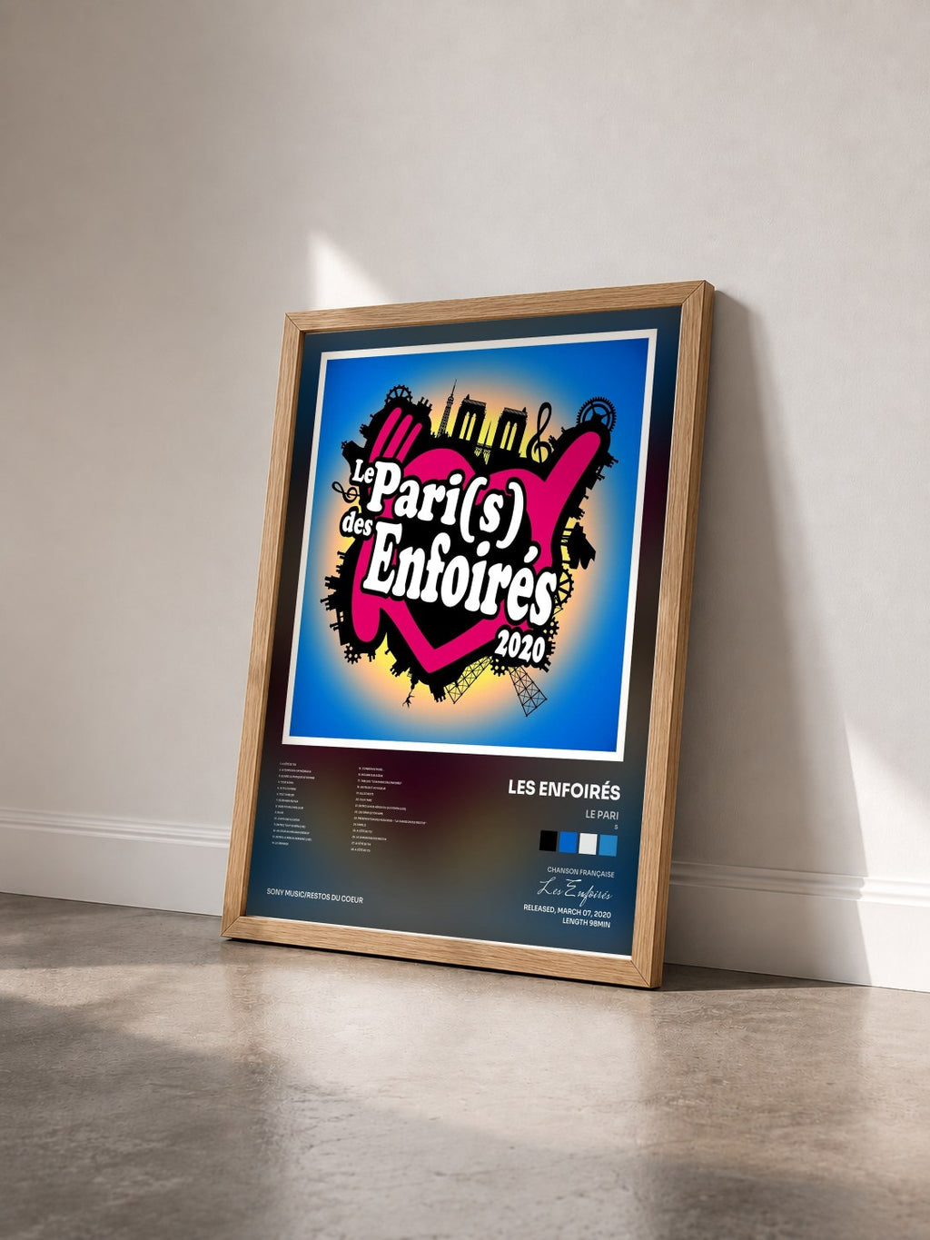 #bois Tableau de l'album Le Pari(s) des Enfoirés 2020 de Les Enfoirés vu de trois quarts, cadre en bois brut