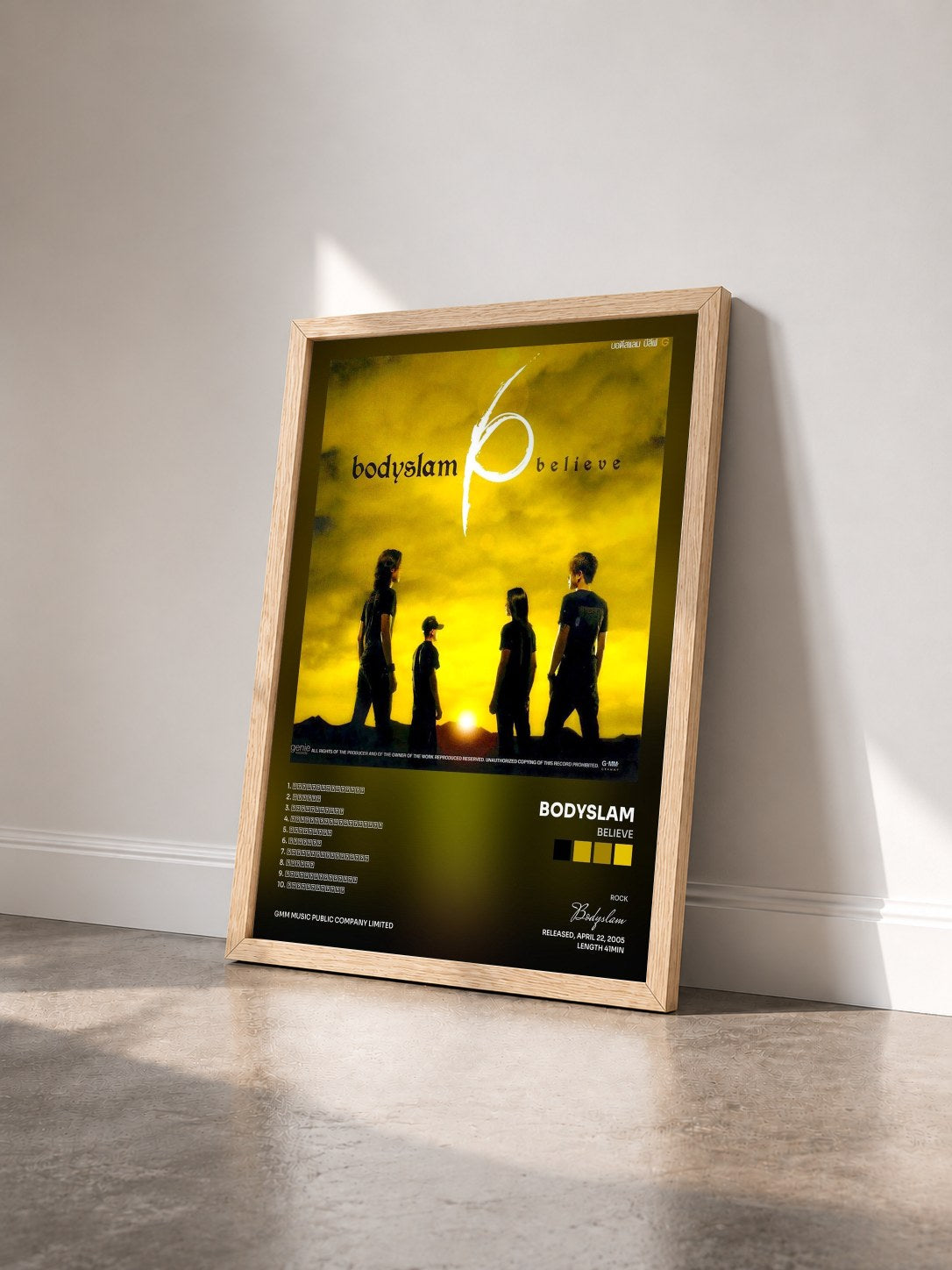 #bois Tableau de l'album believe de Bodyslam vu de trois quarts, cadre en bois brut