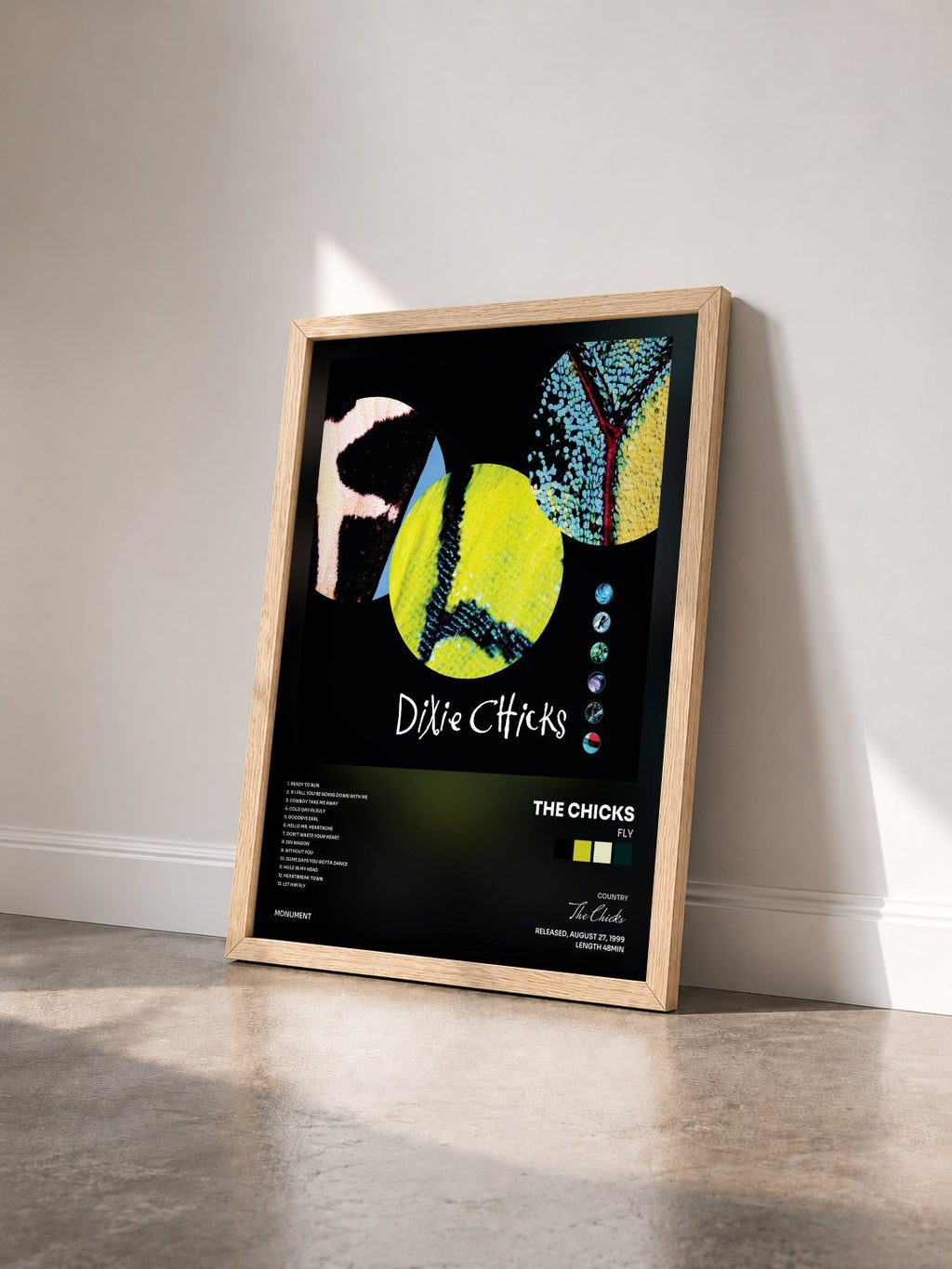 #bois Tableau de l'album Fly de The Chicks vu de trois quarts, cadre en bois brut
