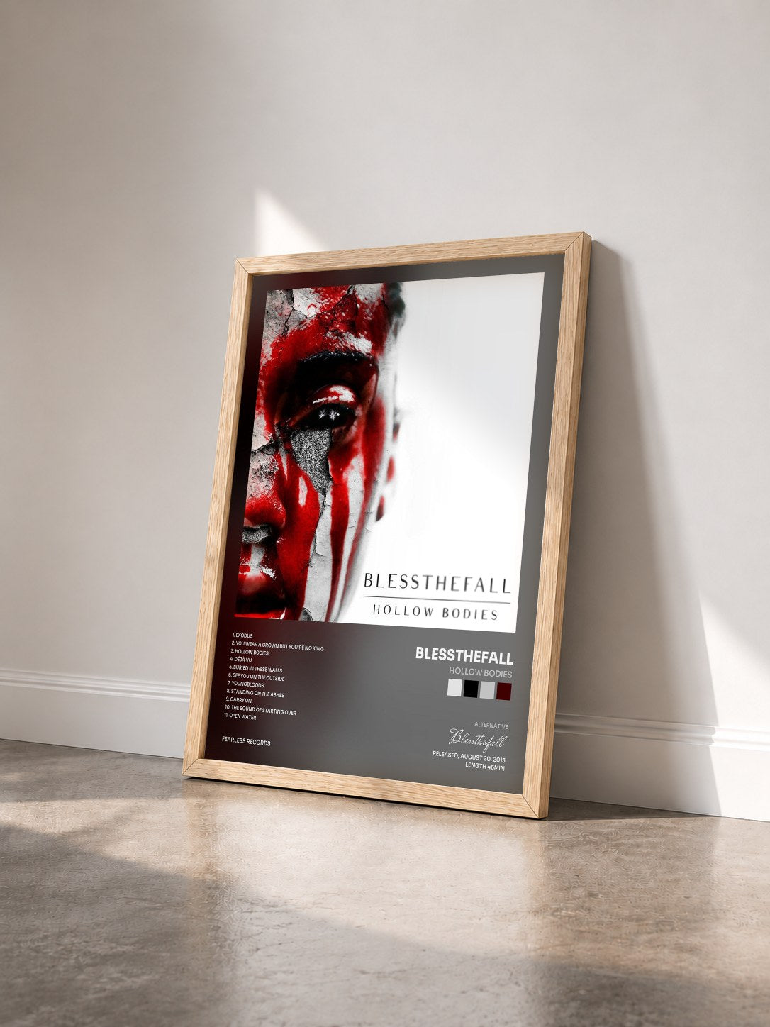 #bois Tableau de l'album Hollow Bodies de Blessthefall vu de trois quarts, cadre en bois brut