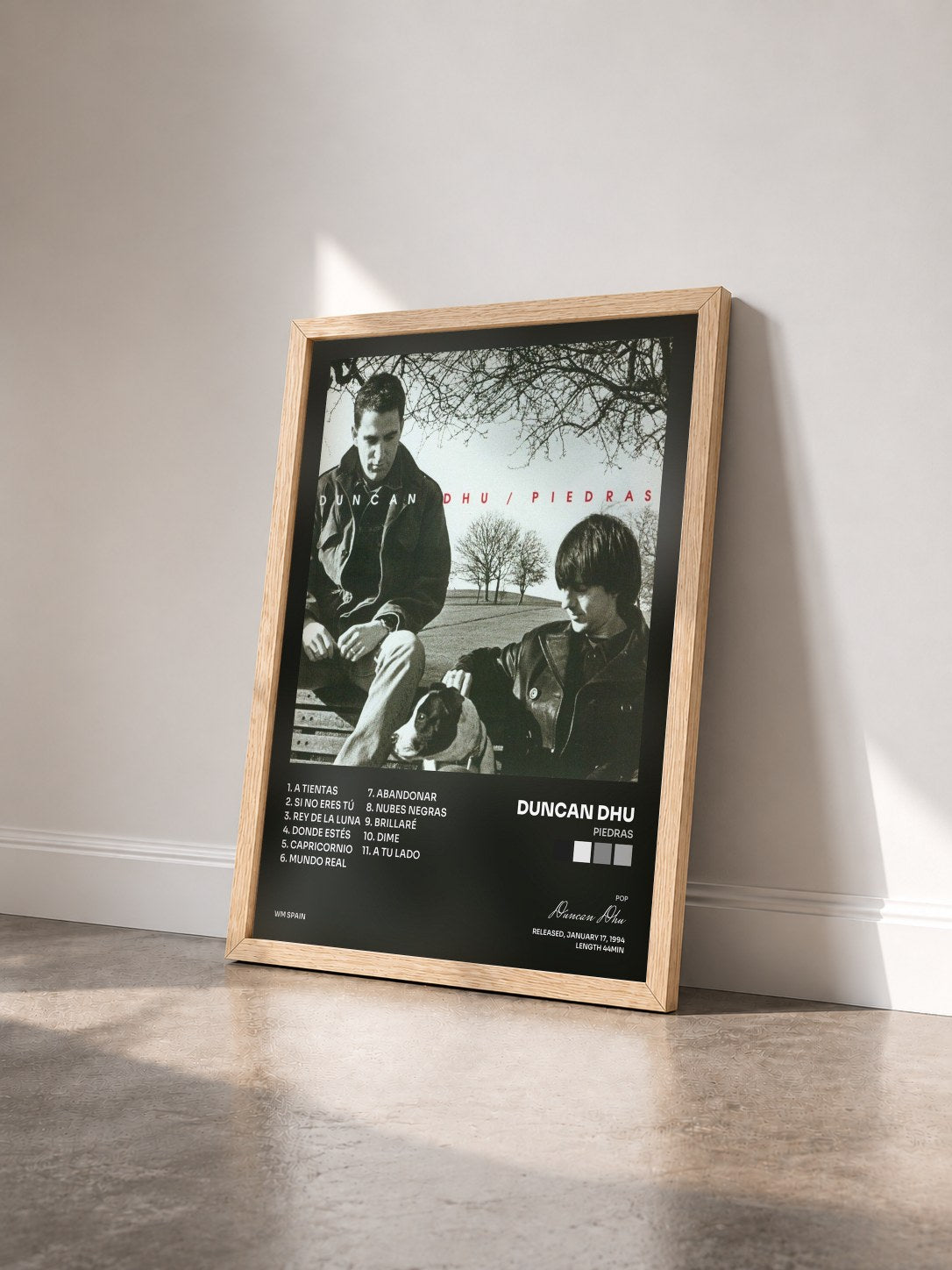 #bois Tableau de l'album Piedras de Duncan Dhu vu de trois quarts, cadre en bois brut
