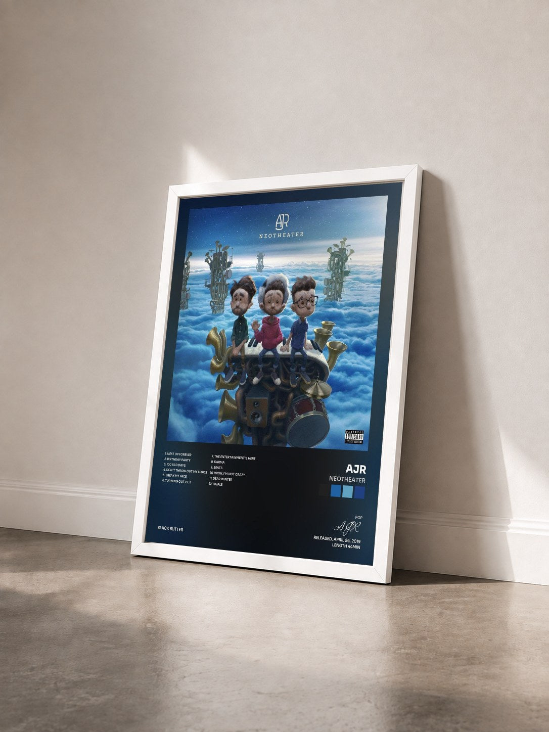 #blanc Tableau de l'album Neotheater de AJR vu de trois quarts, cadre blanc