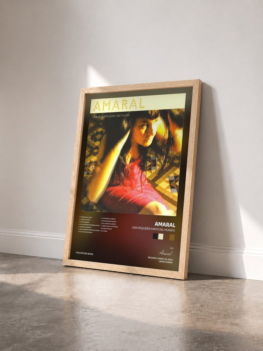 #bois Tableau de l'album Una Pequeña Parte Del Mundo de Amaral vu de trois quarts, cadre en bois brut