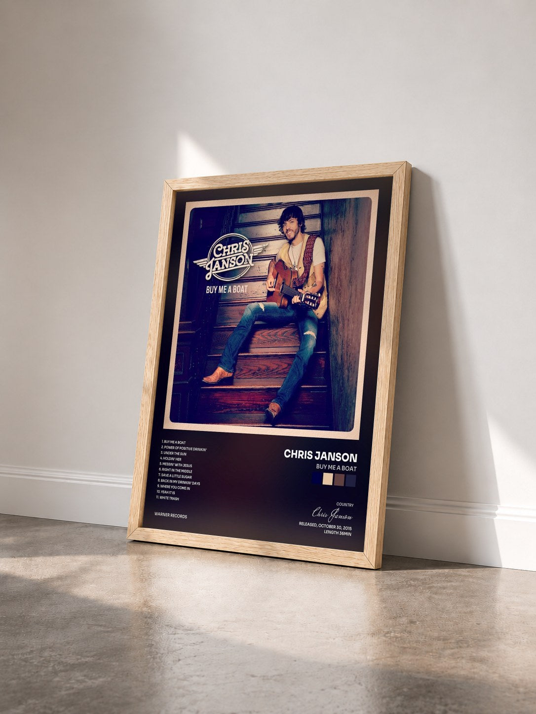 #bois Tableau de l'album Buy Me a Boat de Chris Janson vu de trois quarts, cadre en bois brut