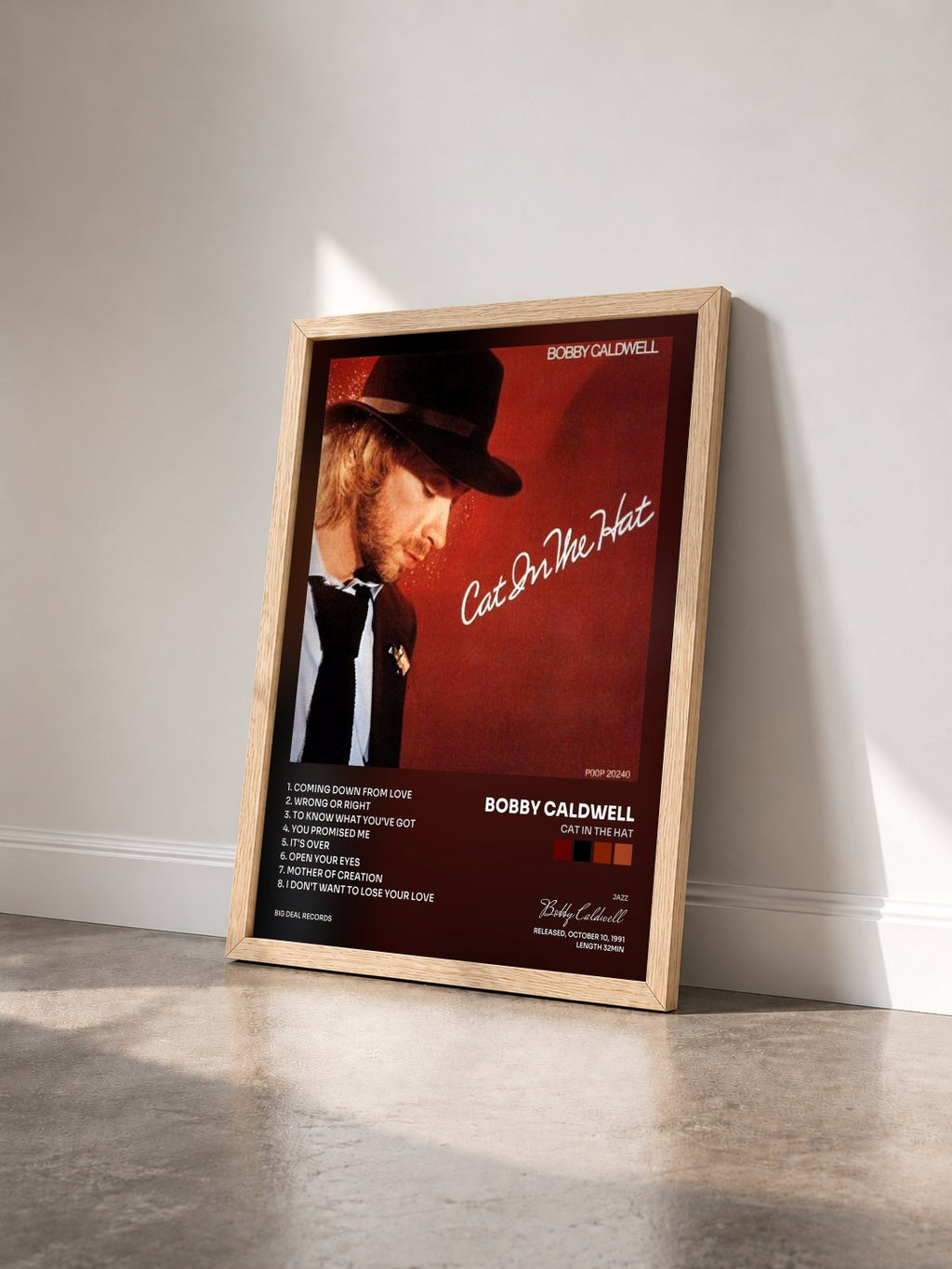 #bois Tableau de l'album Cat in the Hat de Bobby Caldwell vu de trois quarts, cadre en bois brut