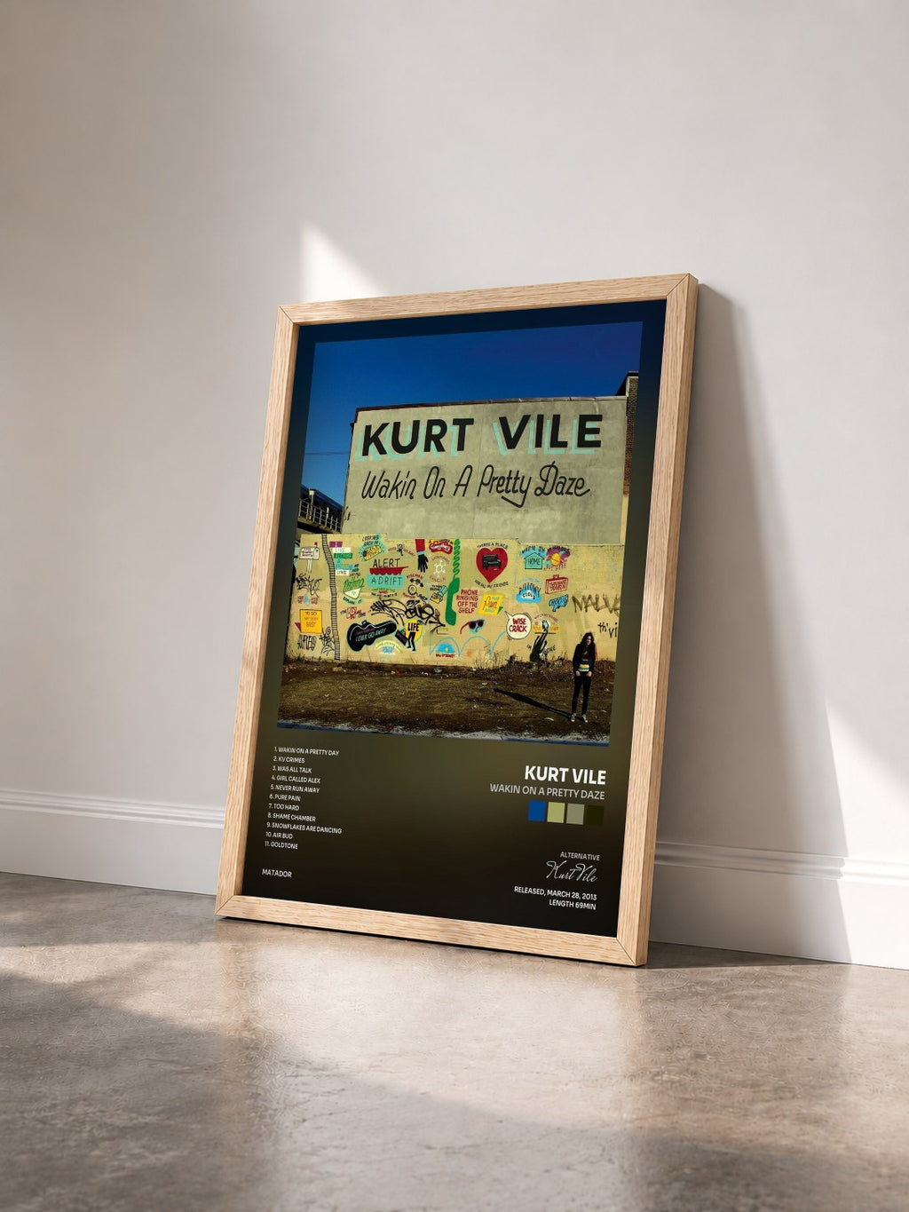 #bois Tableau de l'album Wakin On A Pretty Daze de Kurt Vile vu de trois quarts, cadre en bois brut