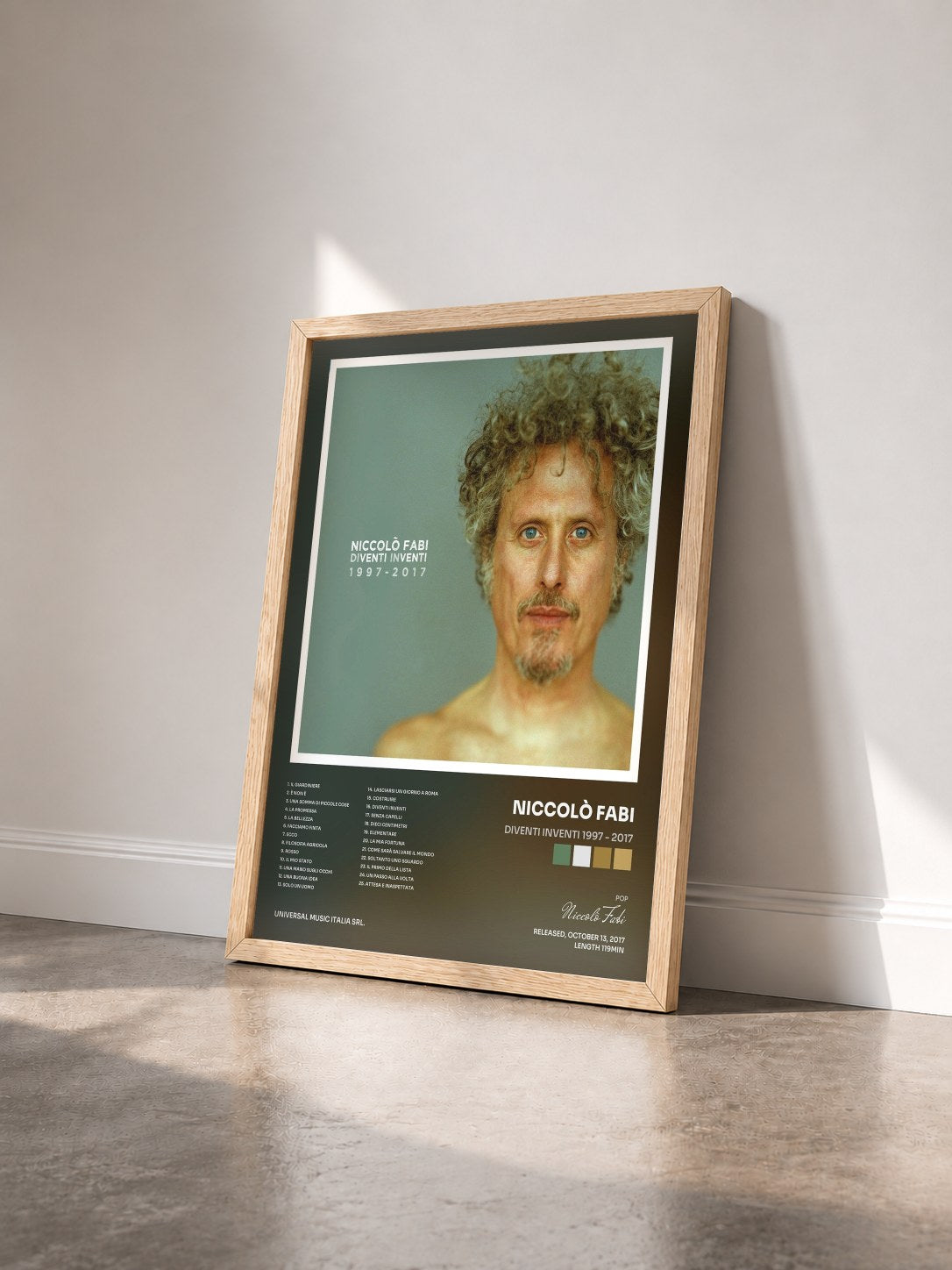 #bois Tableau de l'album Diventi Inventi 1997 - 2017 de Niccolò Fabi vu de trois quarts, cadre en bois brut