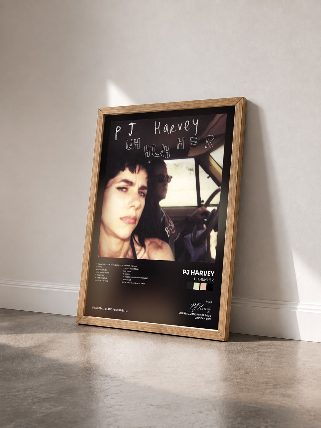 #bois Tableau de l'album Uh Huh Her de PJ Harvey vu de trois quarts, cadre en bois brut