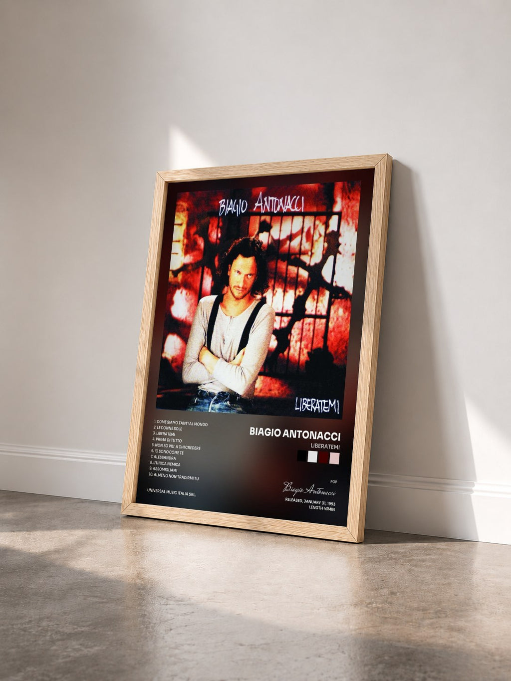 #bois Tableau de l'album Liberatemi de Biagio Antonacci vu de trois quarts, cadre en bois brut