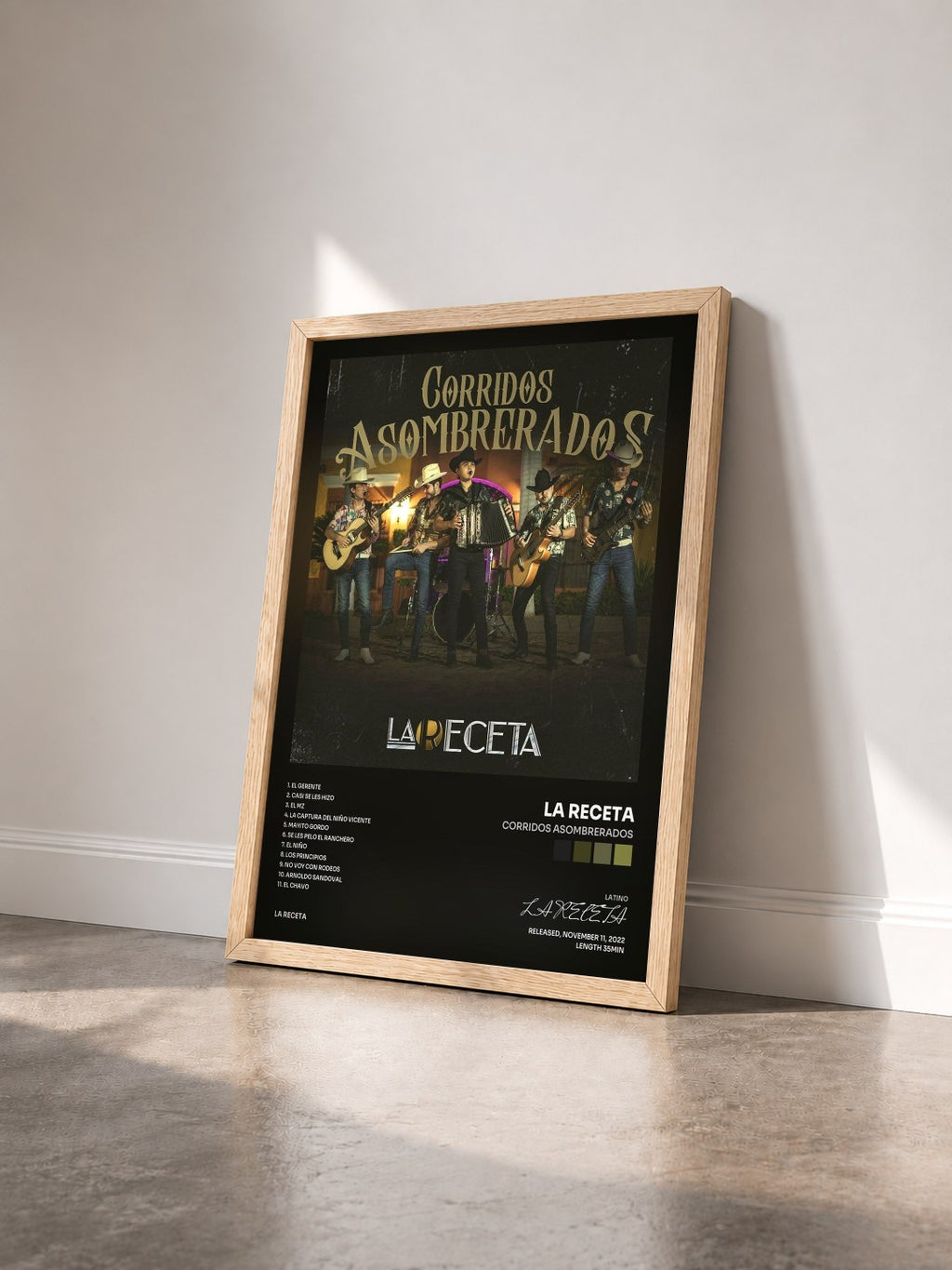 #bois Tableau de l'album Corridos Asombrerados de LA RECETA vu de trois quarts, cadre en bois brut