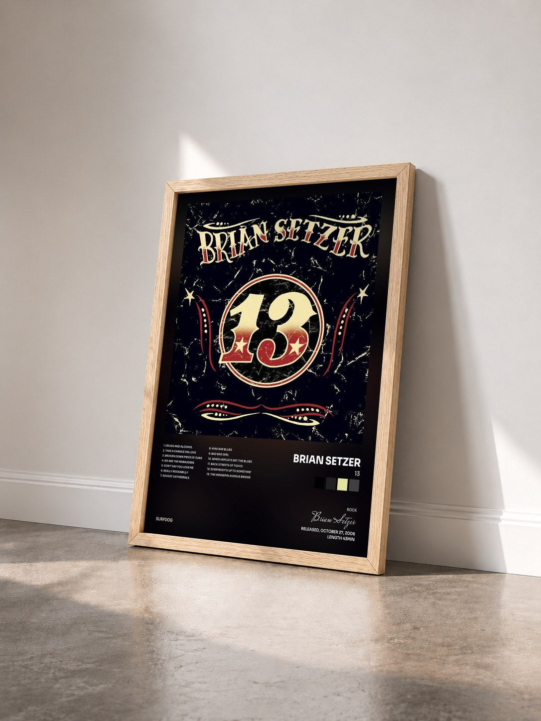 #bois Tableau de l'album 13 de Brian Setzer vu de trois quarts, cadre en bois brut