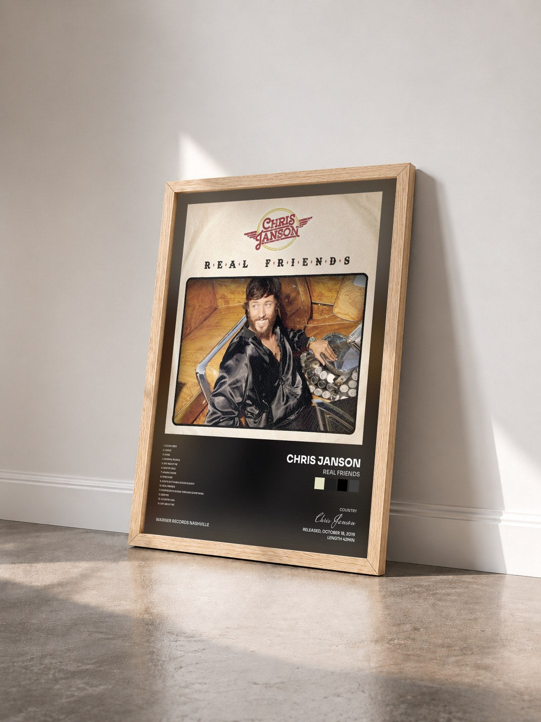 #bois Tableau de l'album Real Friends de Chris Janson vu de trois quarts, cadre en bois brut