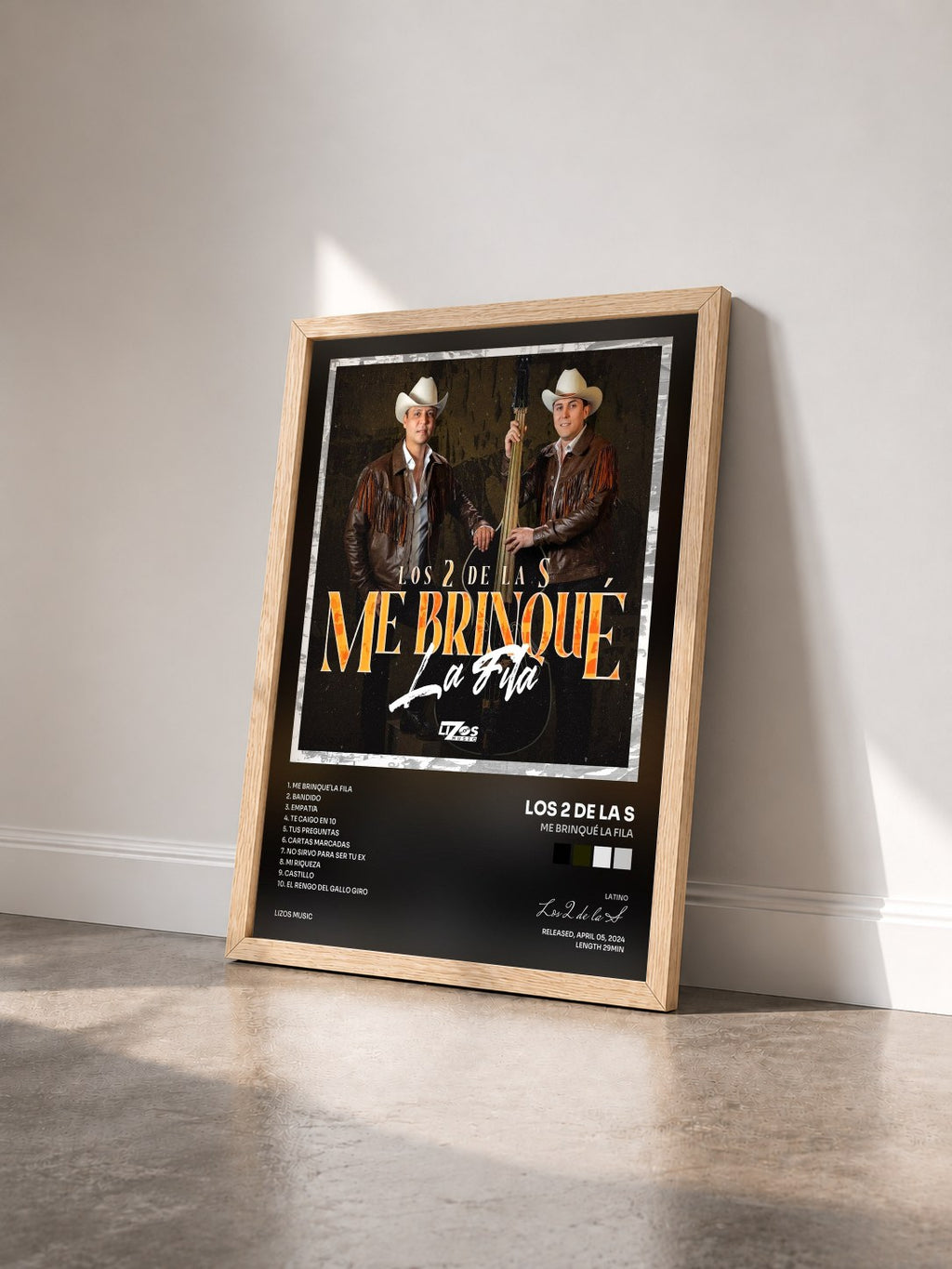 #bois Tableau de l'album Me Brinqué La Fila de Los 2 de la S vu de trois quarts, cadre en bois brut