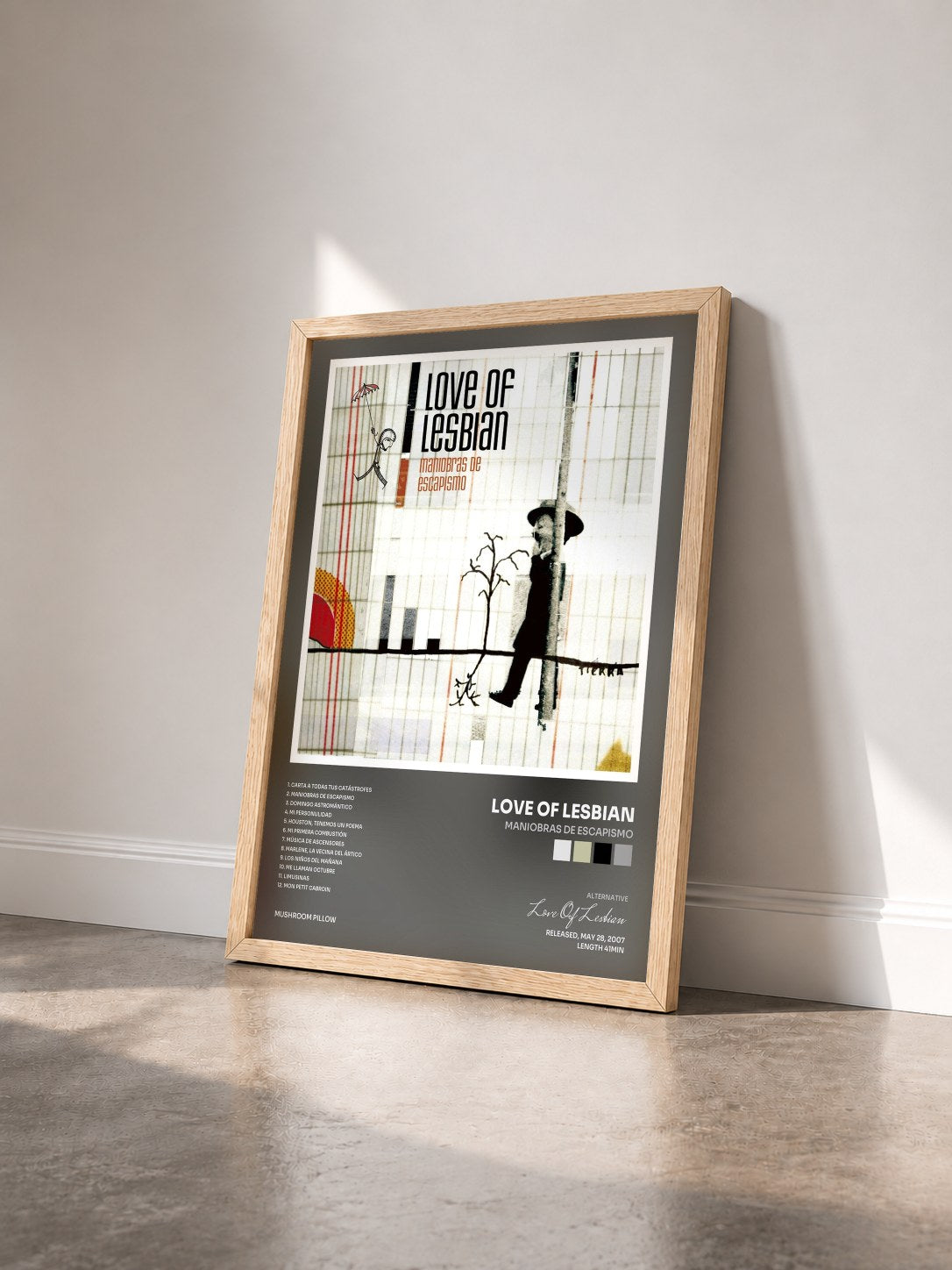 #bois Tableau de l'album Maniobras de Escapismo de Love Of Lesbian vu de trois quarts, cadre en bois brut