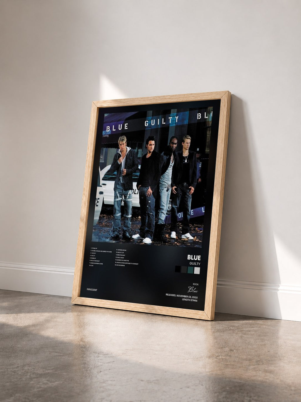 #bois Tableau de l'album Guilty de Blue vu de trois quarts, cadre en bois brut