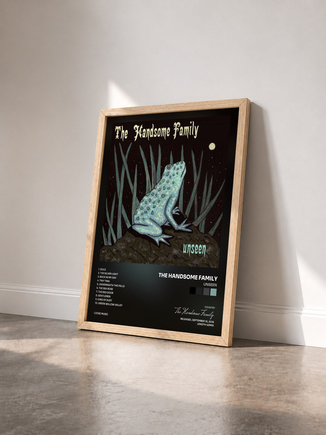 #bois Tableau de l'album Unseen de The Handsome Family vu de trois quarts, cadre en bois brut