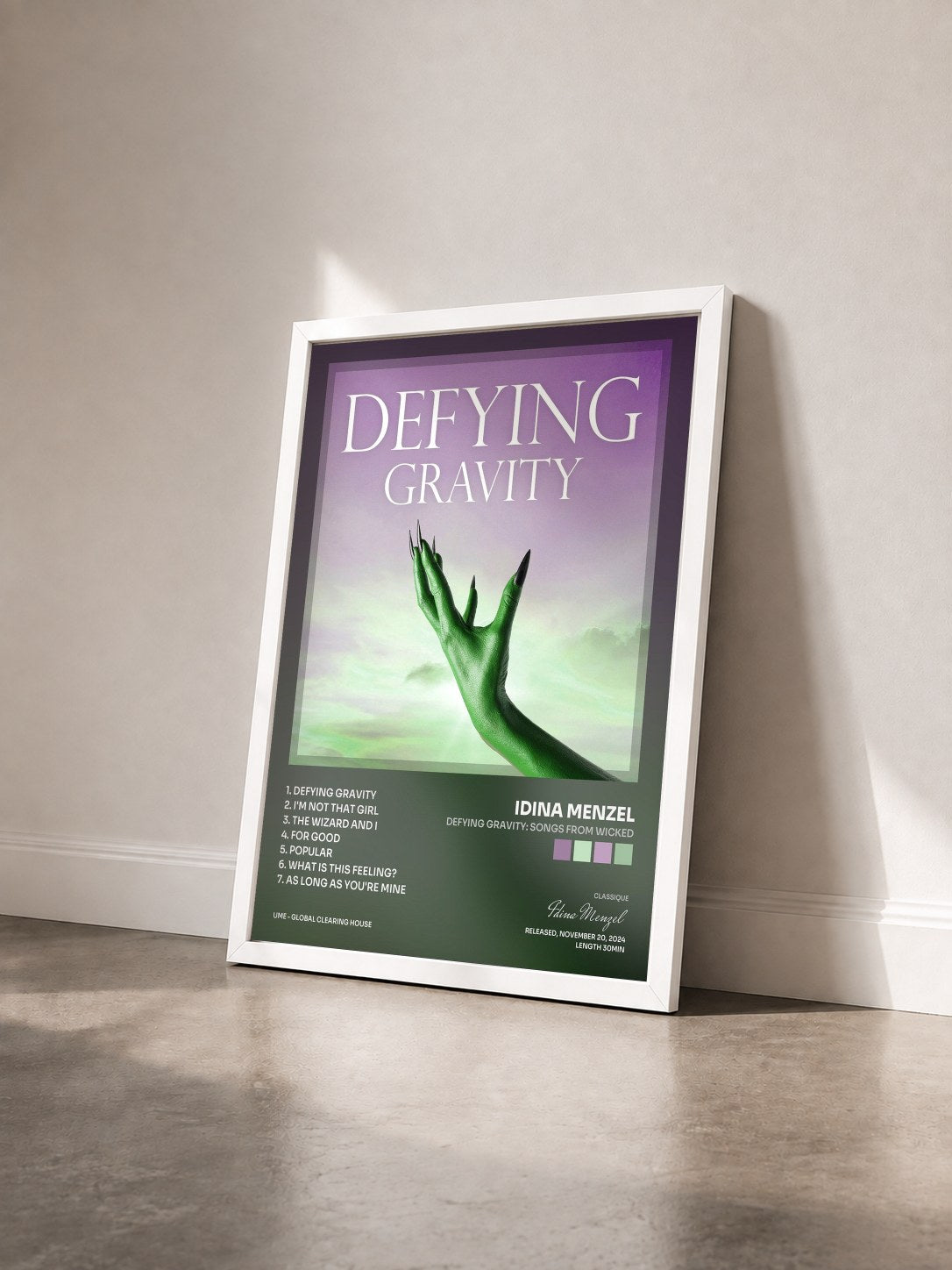 #blanc Tableau de l'album Defying Gravity: Songs from Wicked de Idina Menzel vu de trois quarts, cadre blanc