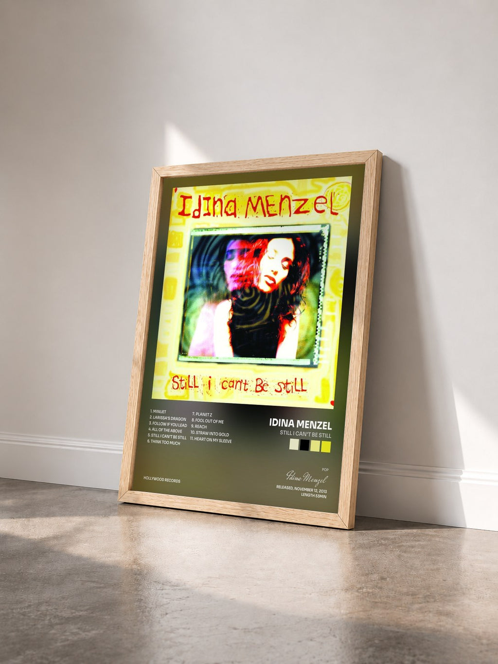 #bois Tableau de l'album Still I Can't Be Still de Idina Menzel vu de trois quarts, cadre en bois brut