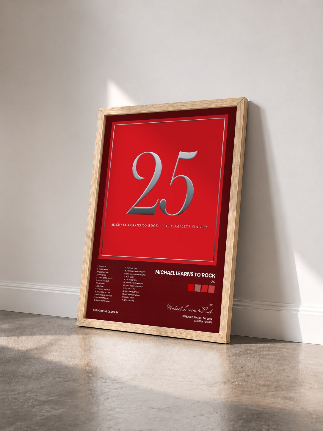 #bois Tableau de l'album 25 de Michael Learns to Rock vu de trois quarts, cadre en bois brut