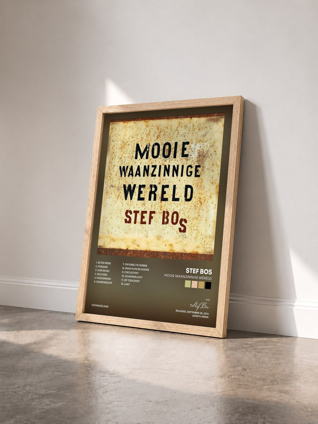 #bois Tableau de l'album Mooie Waanzinnige Wereld de Stef Bos vu de trois quarts, cadre en bois brut