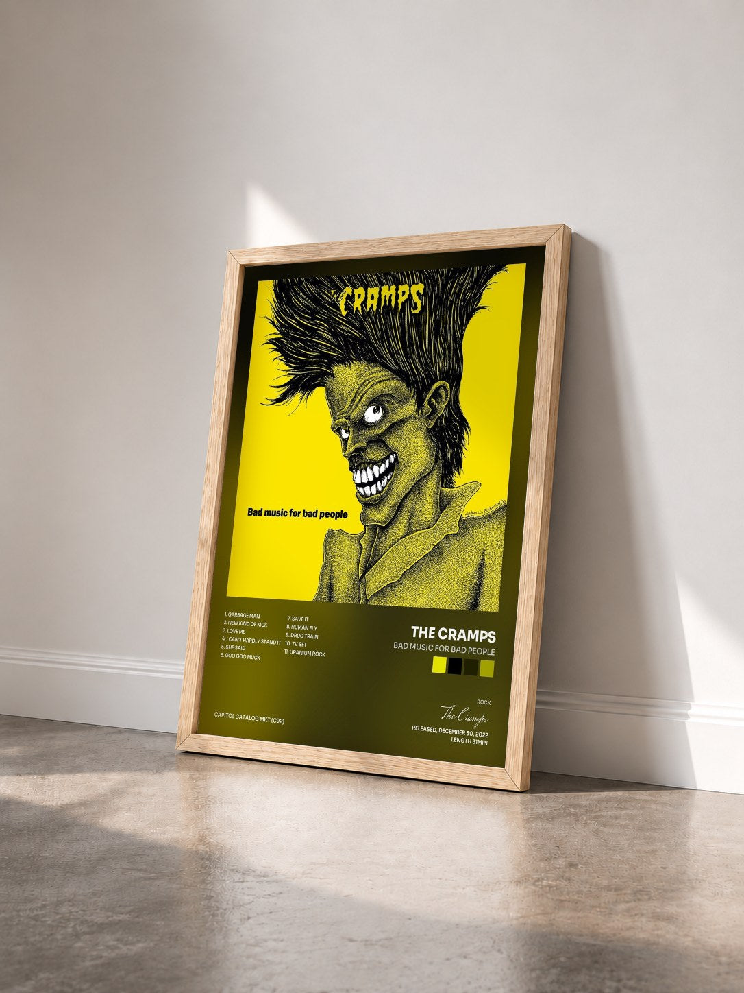 #bois Tableau de l'album Bad Music For Bad People de The Cramps vu de trois quarts, cadre en bois brut