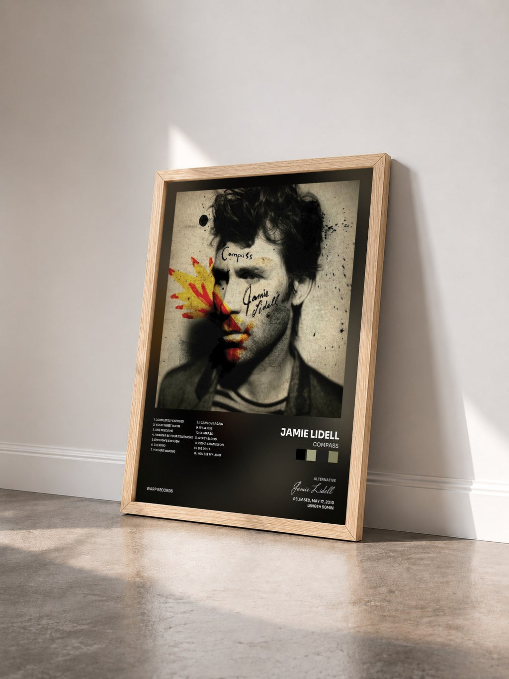 #bois Tableau de l'album Compass de Jamie Lidell vu de trois quarts, cadre en bois brut