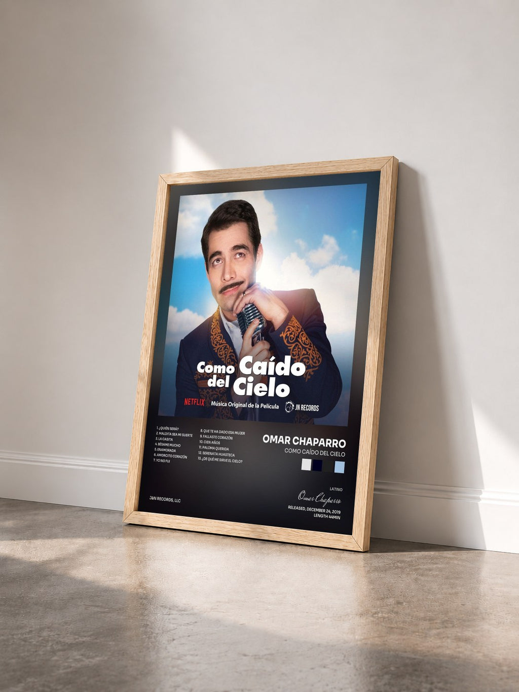 #bois Tableau de l'album Como Caído del Cielo de Omar Chaparro vu de trois quarts, cadre en bois brut