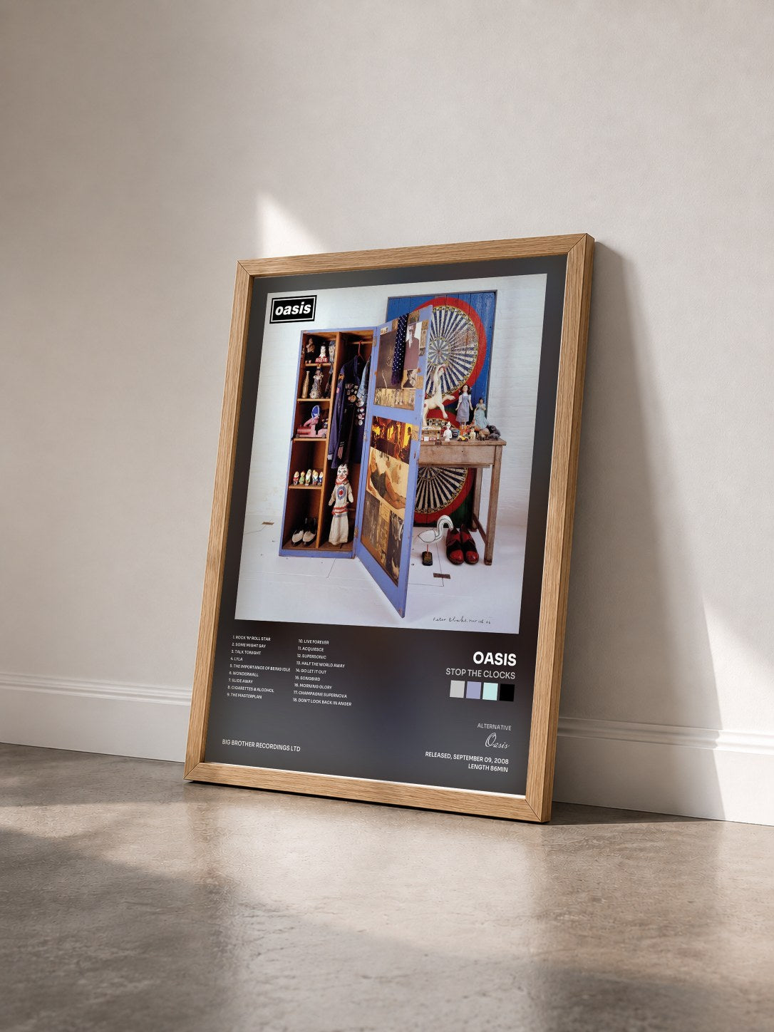 #bois Tableau de l'album Stop The Clocks de Oasis vu de trois quarts, cadre en bois brut