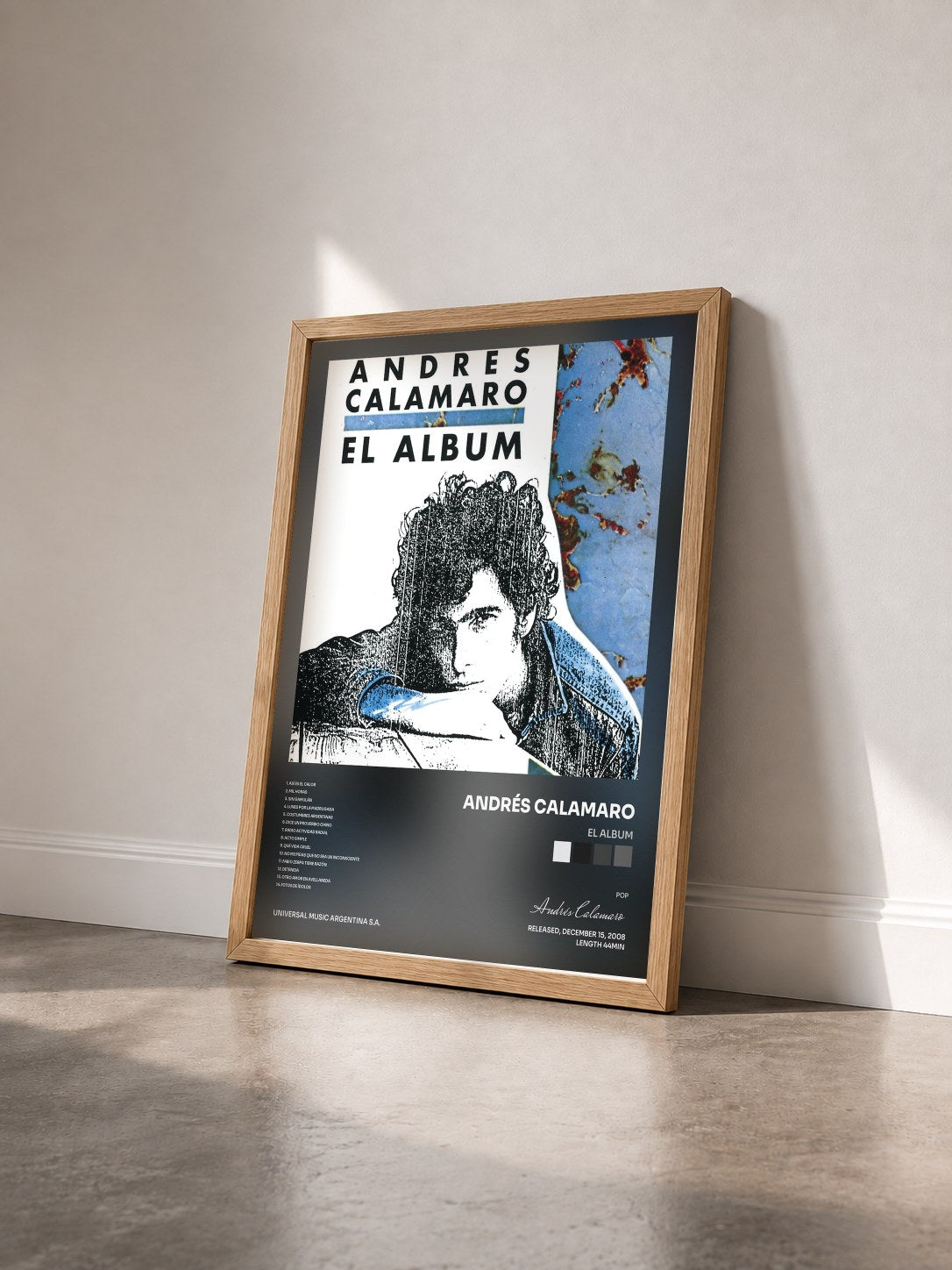 #bois Tableau de l'album El Album de Andrés Calamaro vu de trois quarts, cadre en bois brut