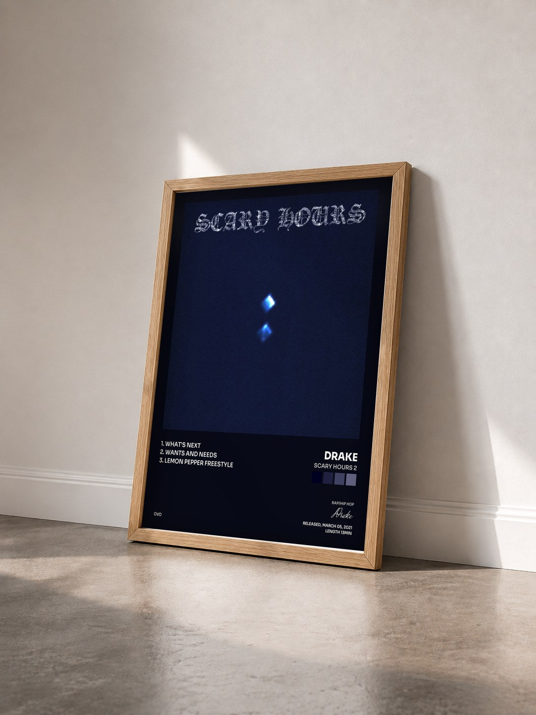 #bois Tableau de l'album Scary Hours 2 de Drake vu de trois quarts, cadre en bois brut