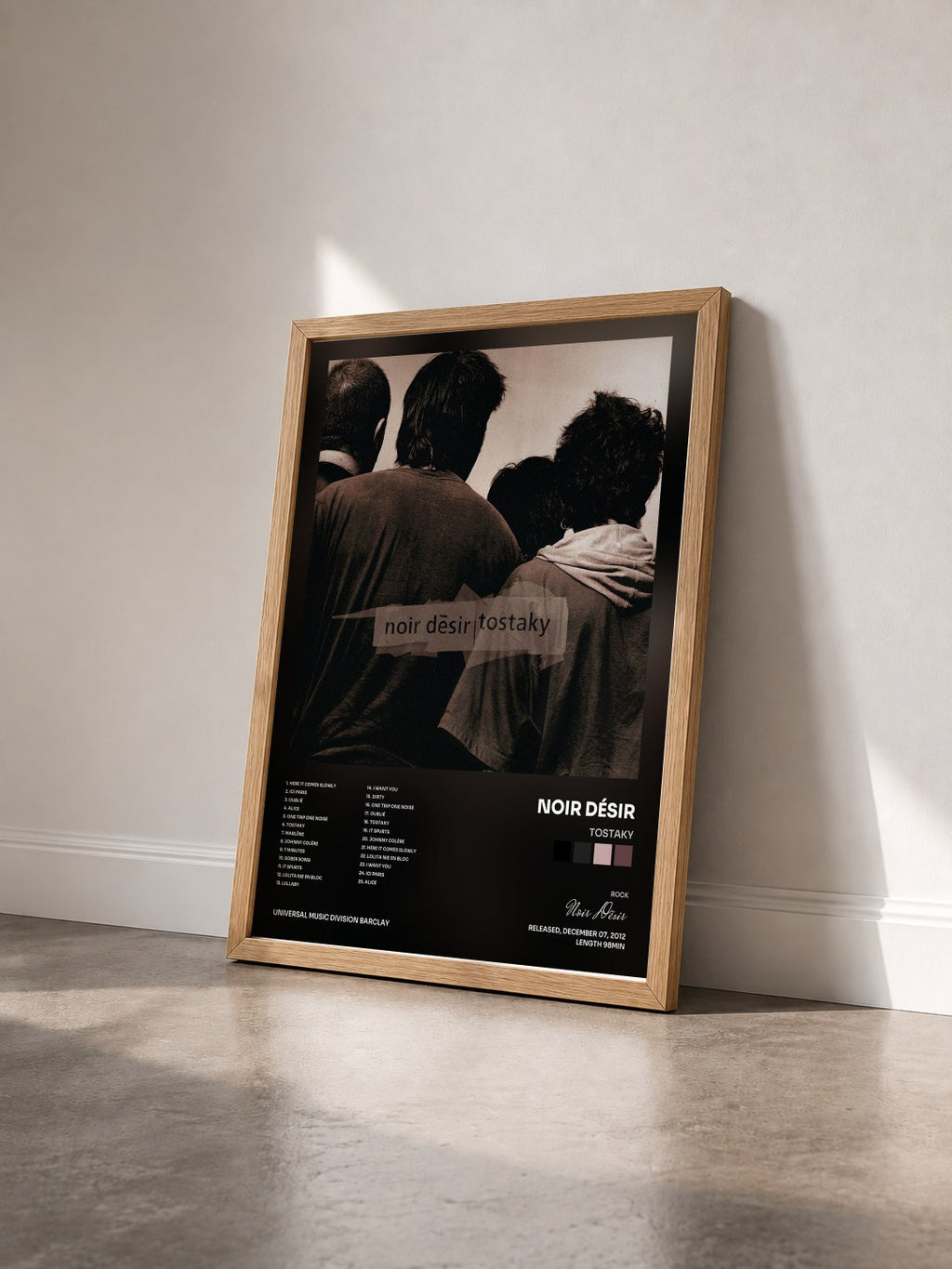 #bois Tableau de l'album Tostaky de Noir Désir vu de trois quarts, cadre en bois brut