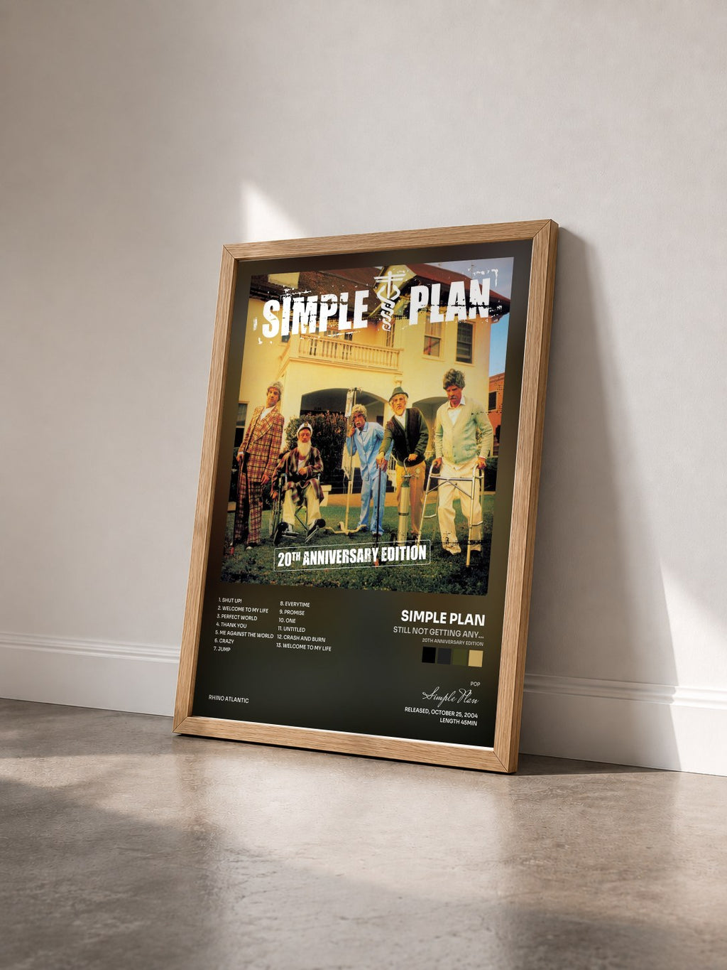 #bois Tableau de l'album Still Not Getting Any... (20th Anniversary Edition) de Simple Plan vu de trois quarts, cadre en bois brut