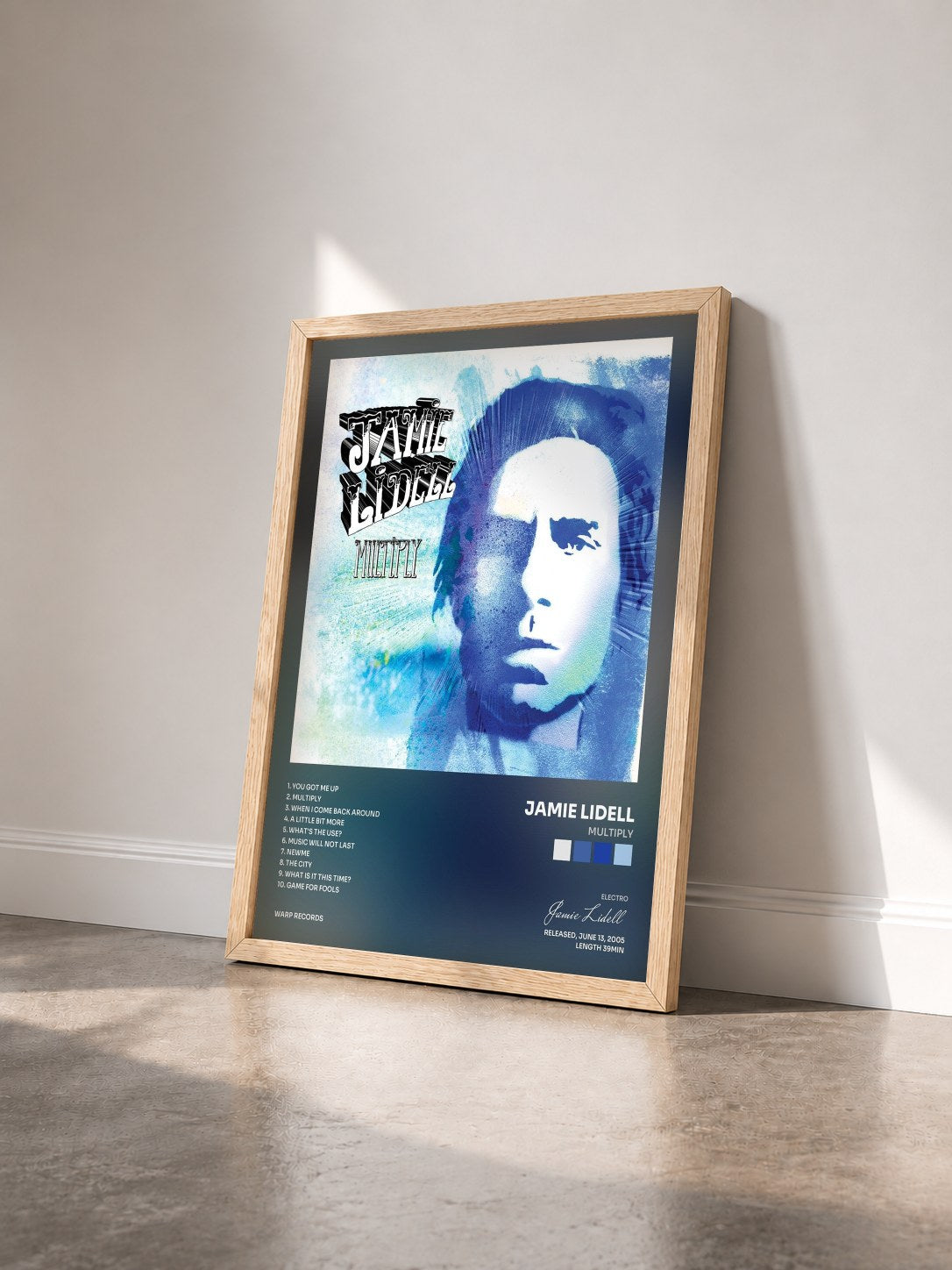#bois Tableau de l'album Multiply de Jamie Lidell vu de trois quarts, cadre en bois brut