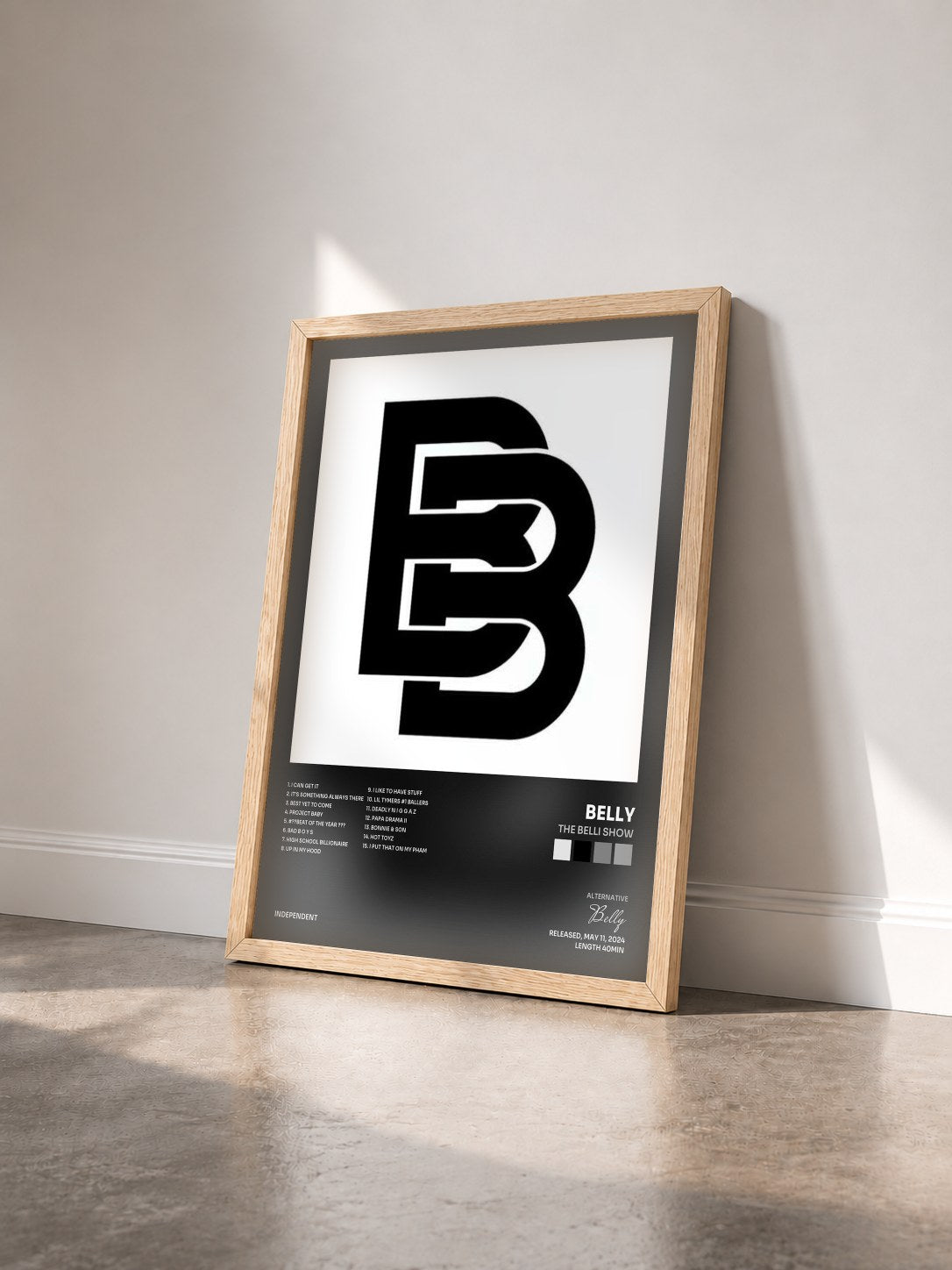 #bois Tableau de l'album The Belli Show de Belly vu de trois quarts, cadre en bois brut