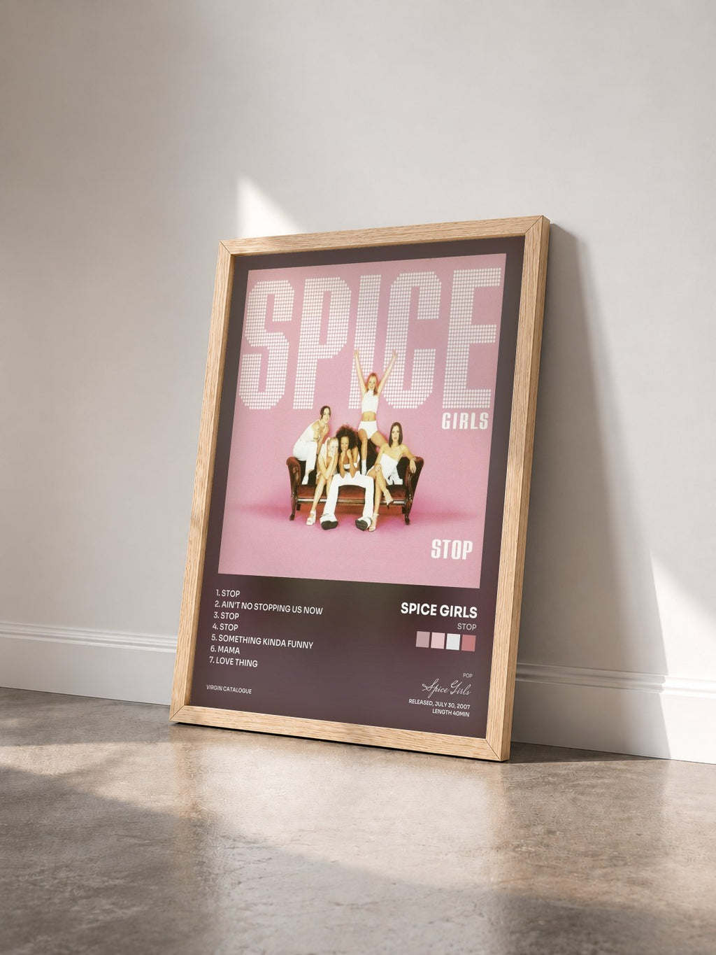#bois Tableau de l'album Stop de Spice Girls vu de trois quarts, cadre en bois brut
