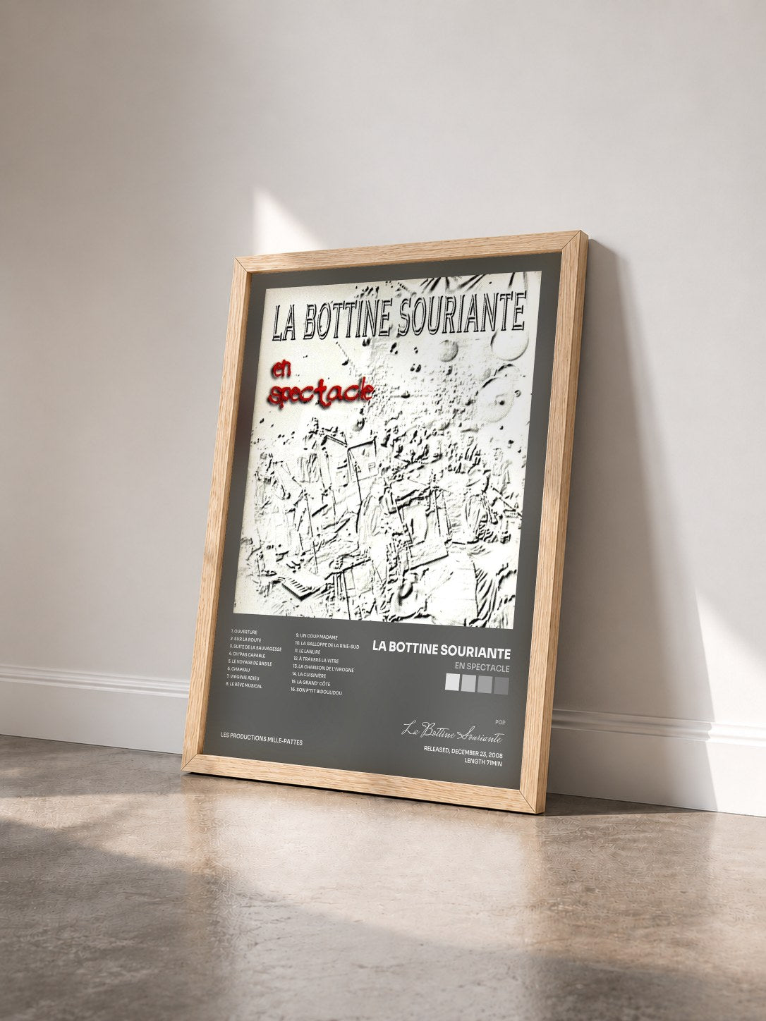 #bois Tableau de l'album En spectacle de La Bottine Souriante vu de trois quarts, cadre en bois brut