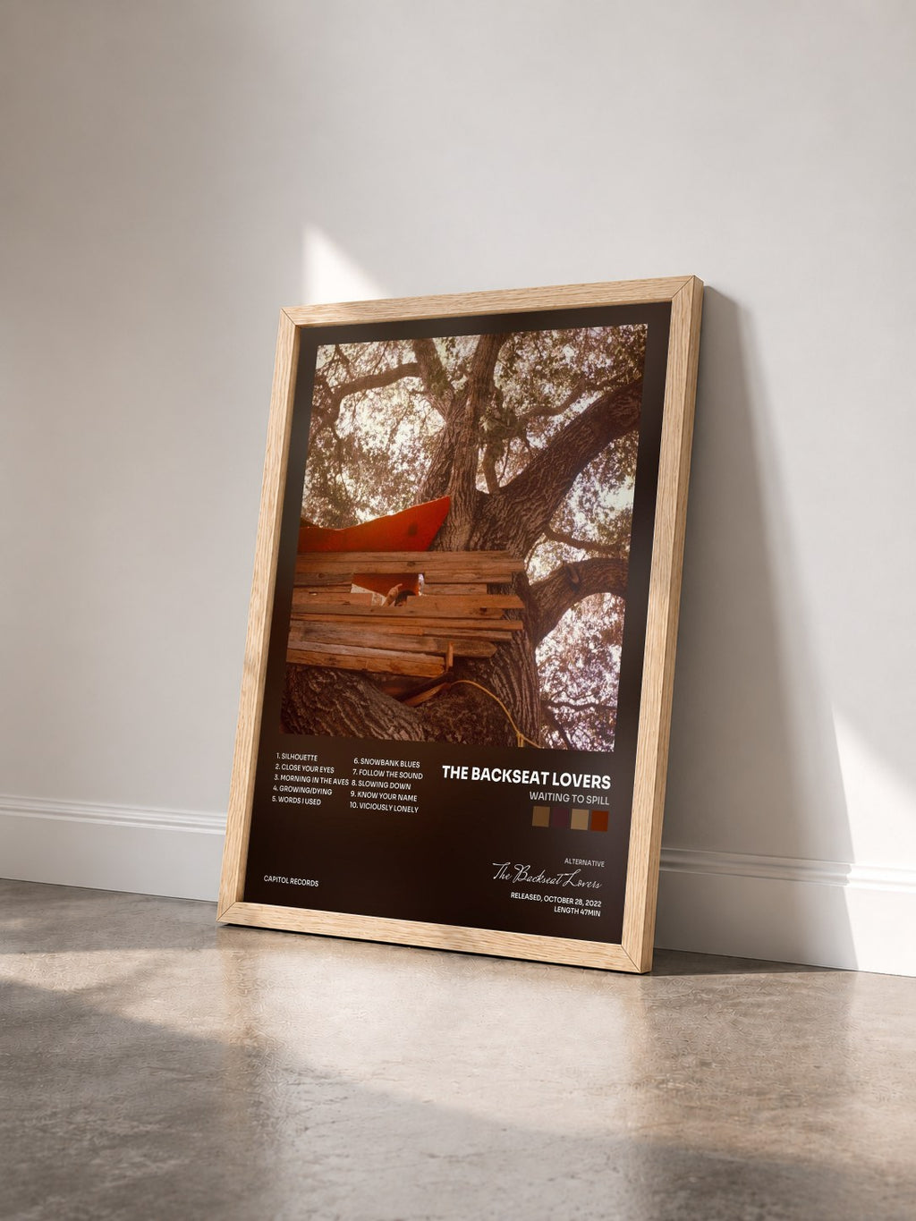 #bois Tableau de l'album Waiting to Spill de The Backseat Lovers vu de trois quarts, cadre en bois brut