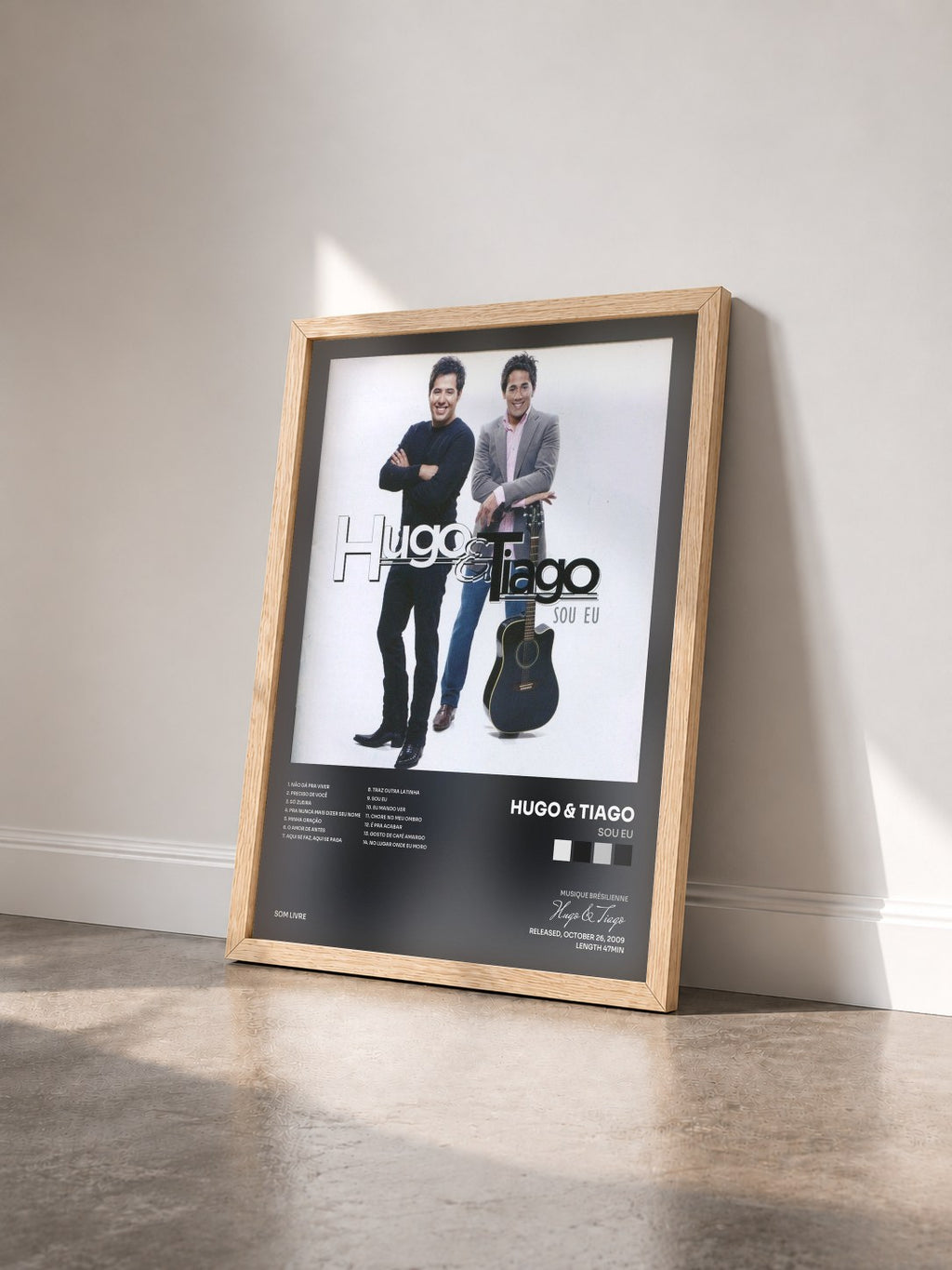 #bois Tableau de l'album Sou Eu de Hugo & Tiago vu de trois quarts, cadre en bois brut