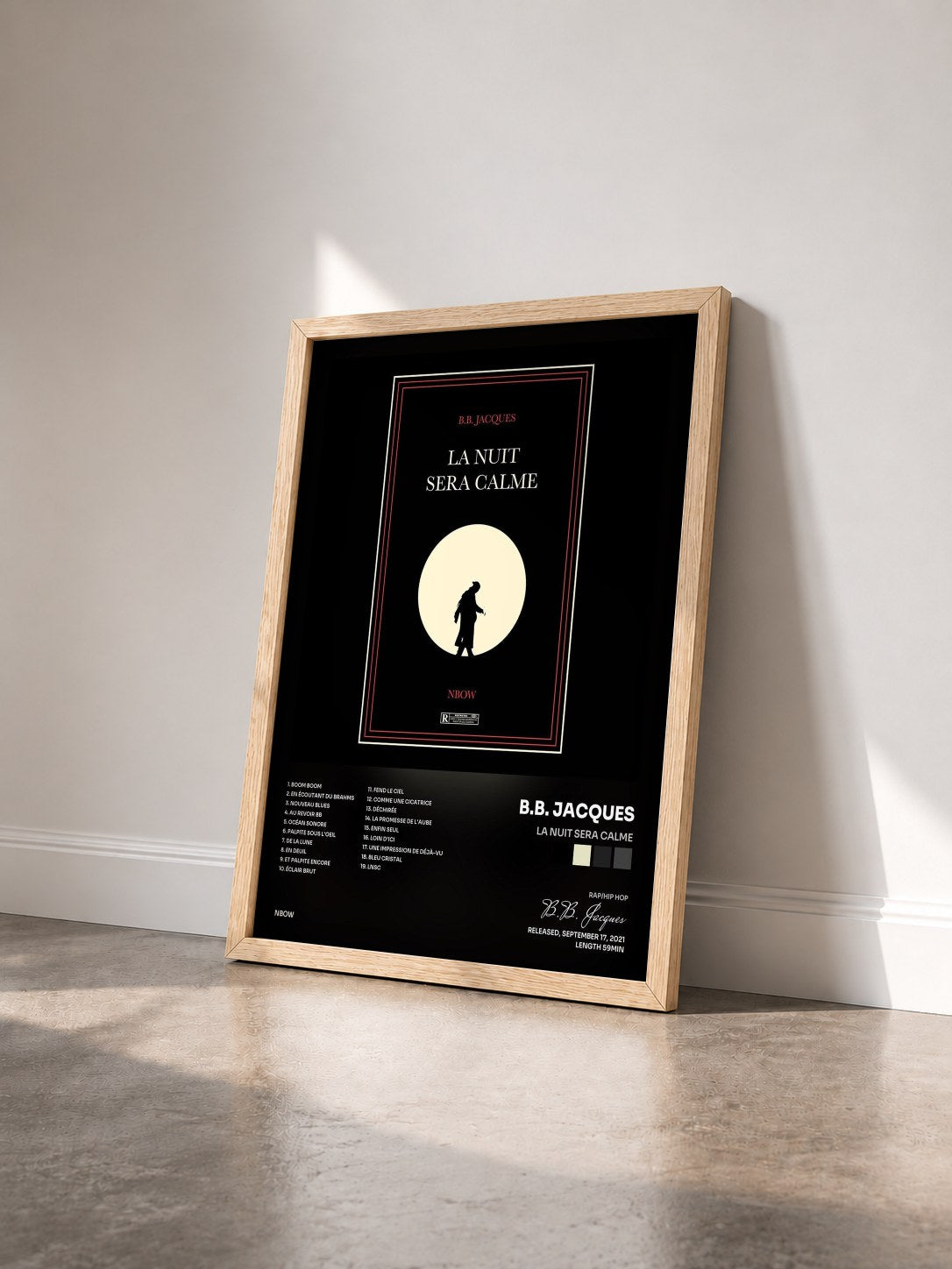 #bois Tableau de l'album La nuit sera calme de B.B. Jacques vu de trois quarts, cadre en bois brut