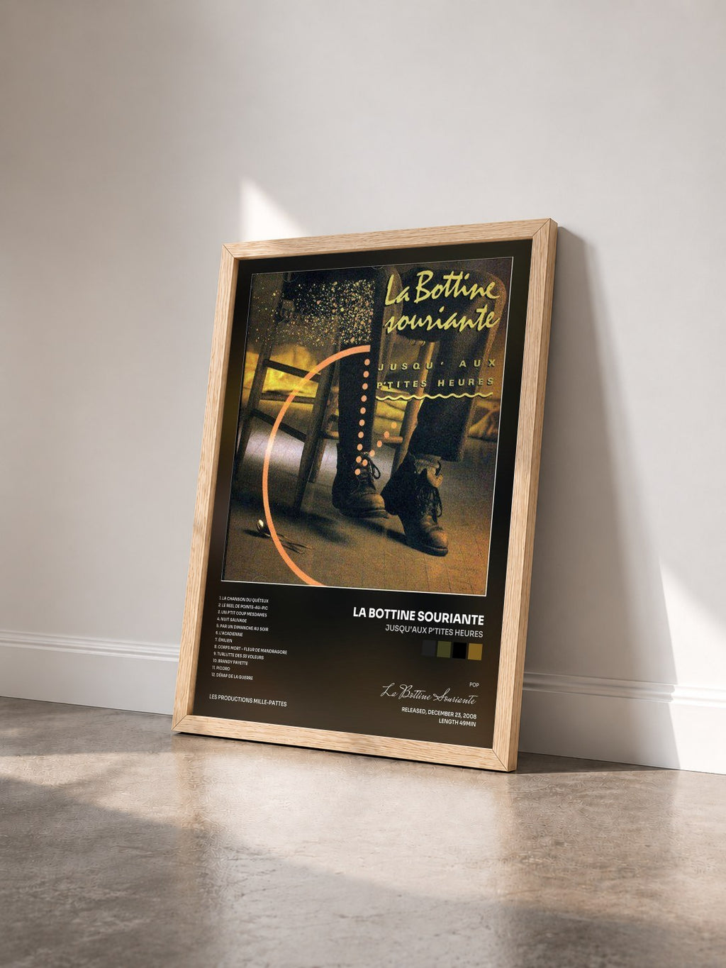 #bois Tableau de l'album Jusqu'aux p'tites heures de La Bottine Souriante vu de trois quarts, cadre en bois brut